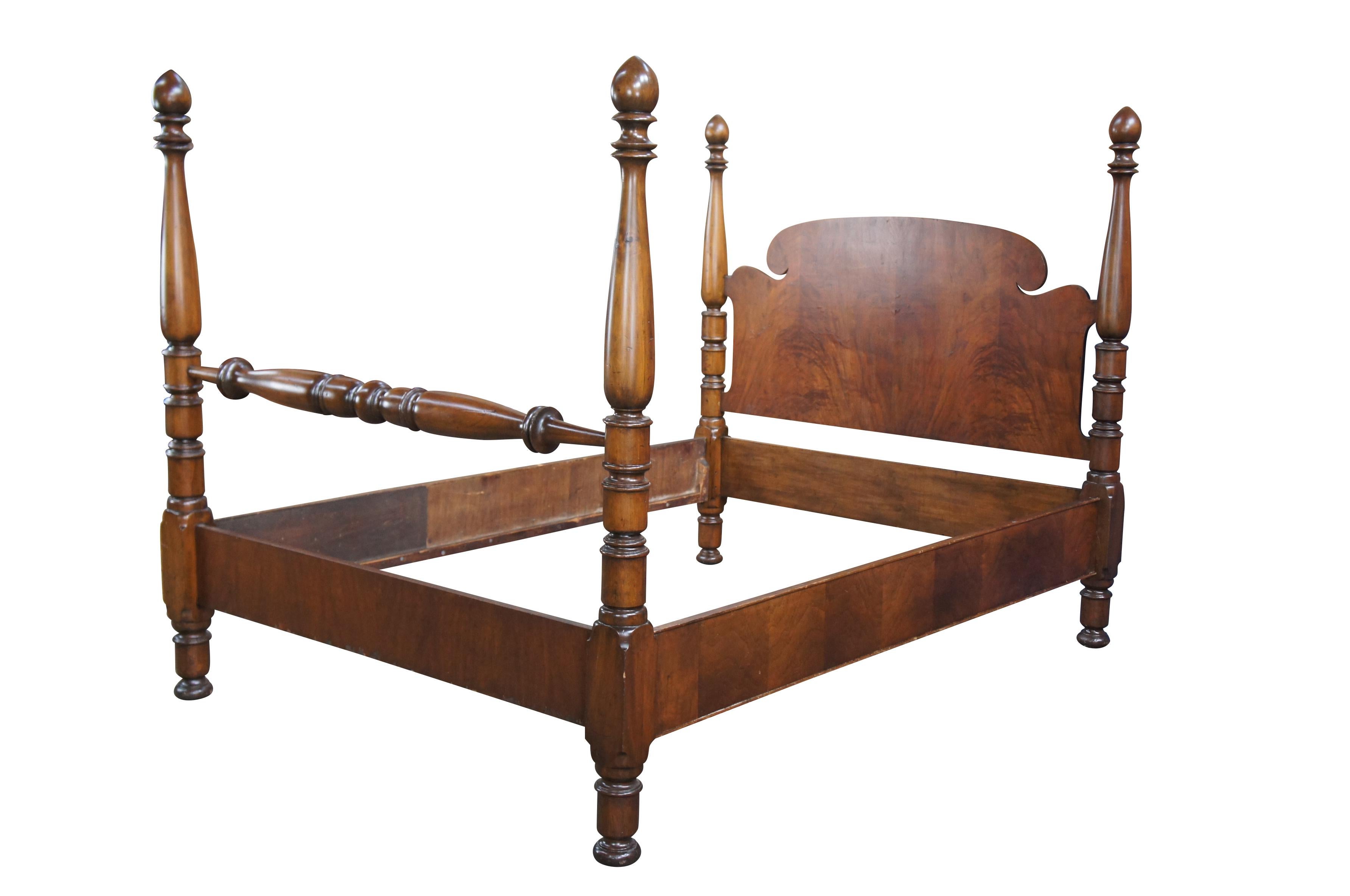 Early 20th century Georgian style poster bed.  Made from mahogany with beautiful matchbook veneer on the head, foot and side rails.  Features hand turned poasts with pointed finials and bun feet.  

Dimensions:
59