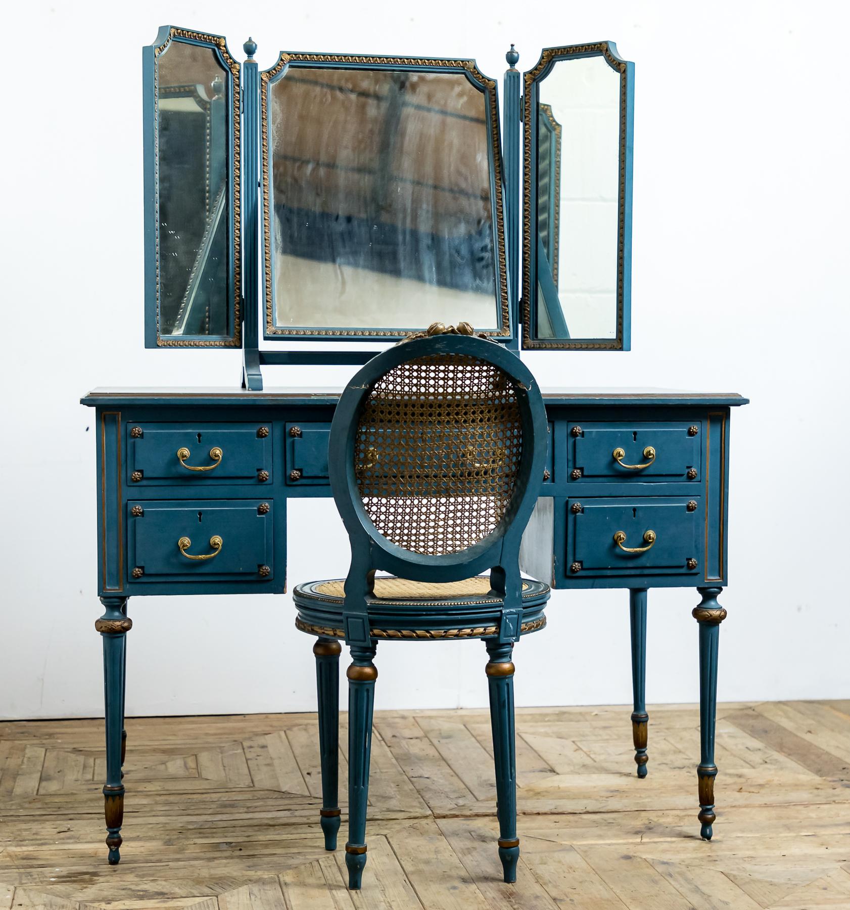 A lovely blue painted dressing table with triptych mirror and bergere chair. In the original paint with gold highlights and gilt brass fittings.

Date:
Early to mid-20th century
circa 1930-1950.

Approx. Dimensions:
Dressing table - 109cm