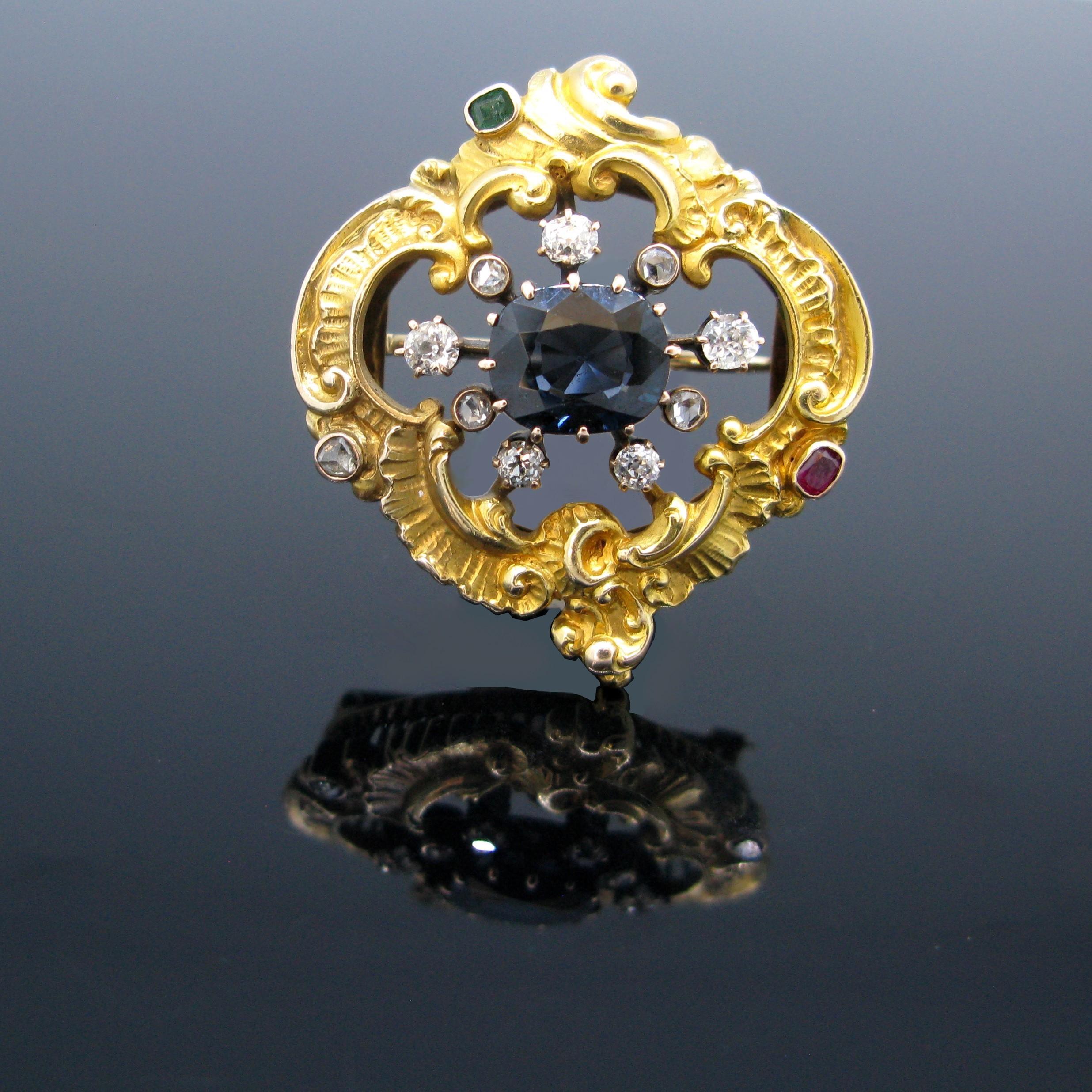 A ravishing brooch from early 19th century set with a blue spinel (2.50ct approximately) in the center and surrounded by 5 old cut diamonds and 5 rose cut diamonds. The top was tested as 18kt gold and the pin at the back was tested as 14kt gold. The