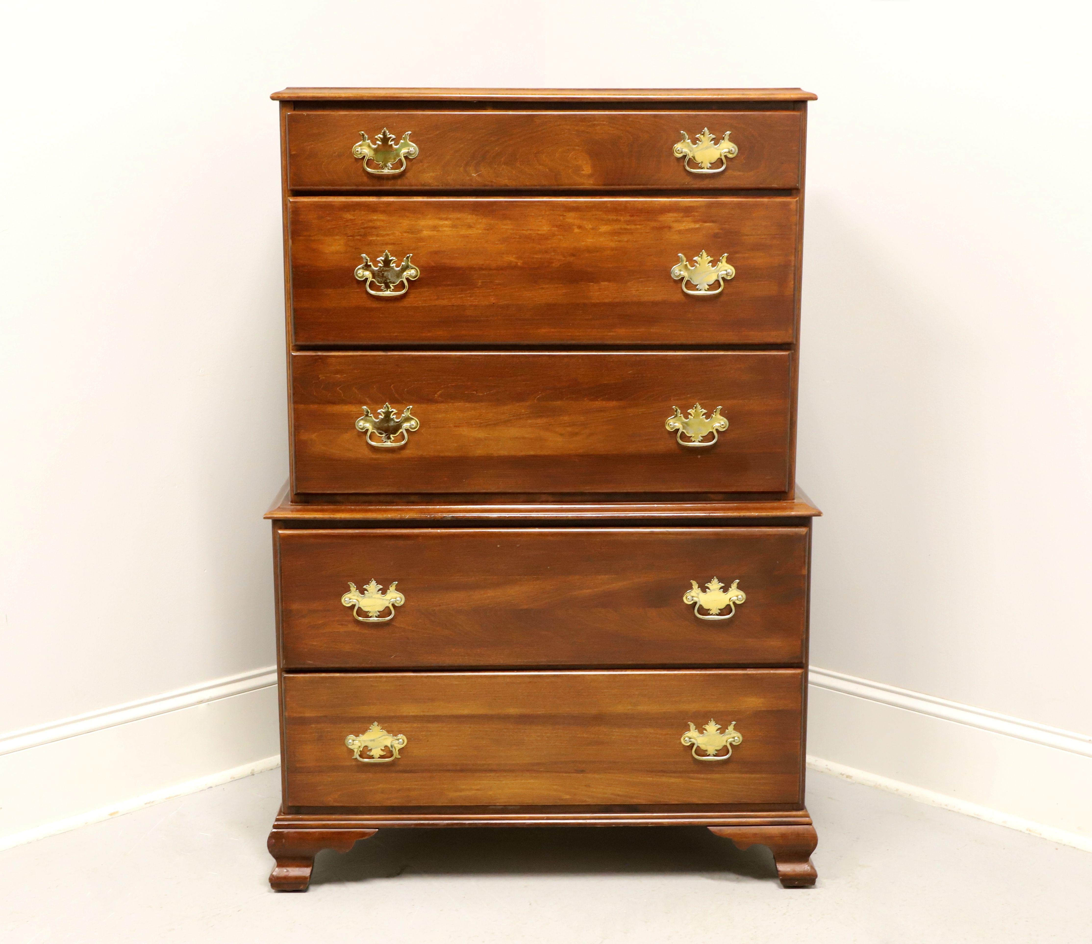 An antique Chippendale style chest on chest of drawers, unbranded. Cherry with brass hardware, ogee edge to the top, ogee edge dividing chests, and ogee bracket feet. Features five various size drawers of dovetail construction, with top two drawers