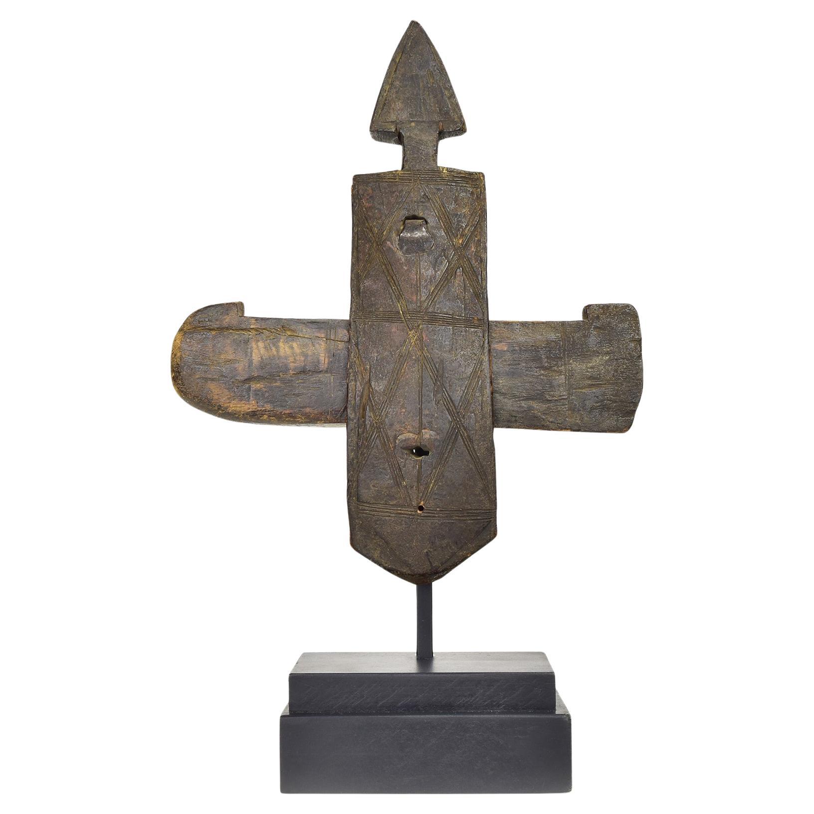 What does the wooden granary door depict in Dogon?