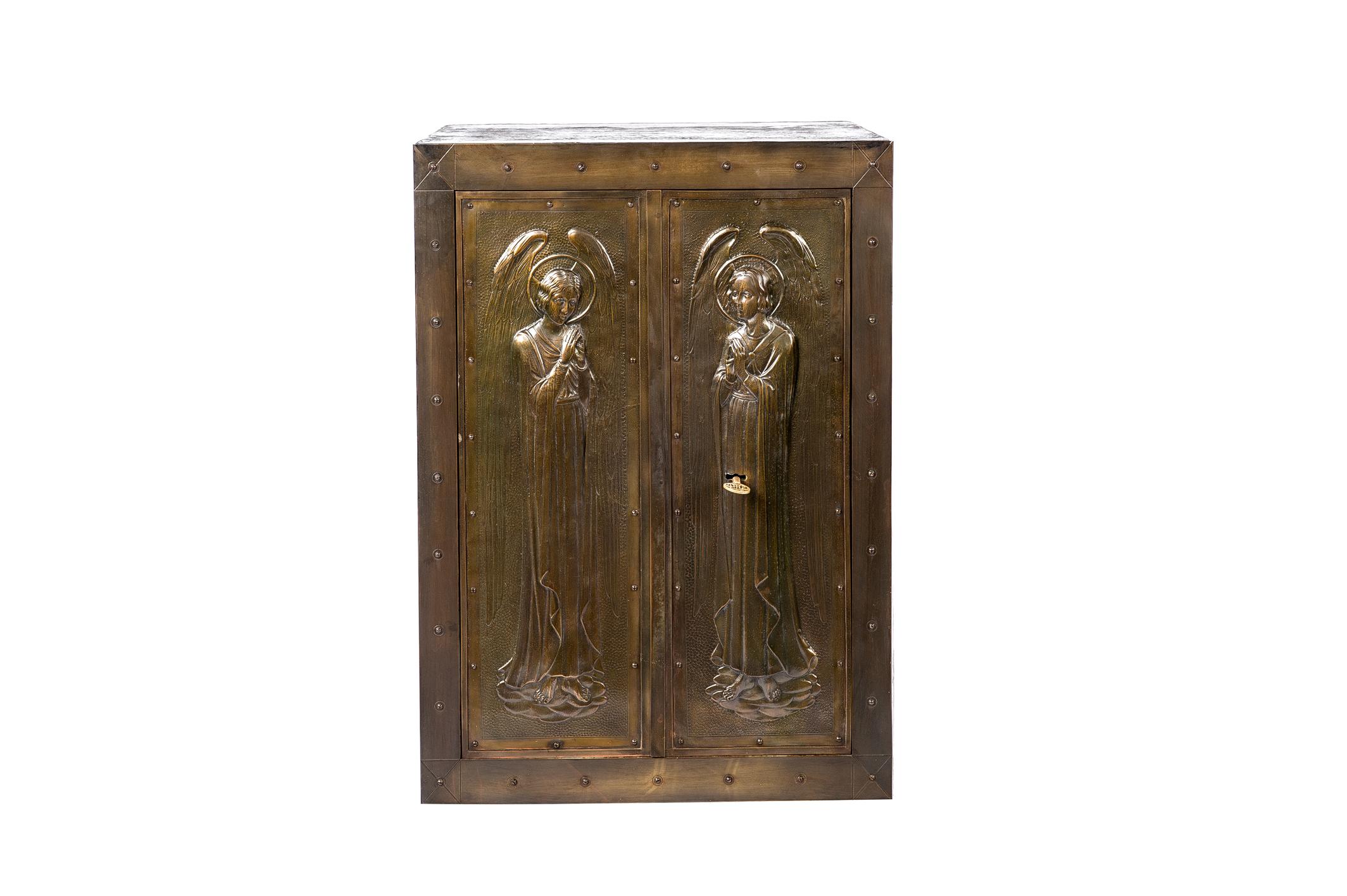 A beautiful unique antique forged steel safe or tabernacle with double doors. The doors are decorated with two angels with wings and a nimbus. The door panels were made from sheets of brass and the decorations were hammered in elegant Art Nouveau