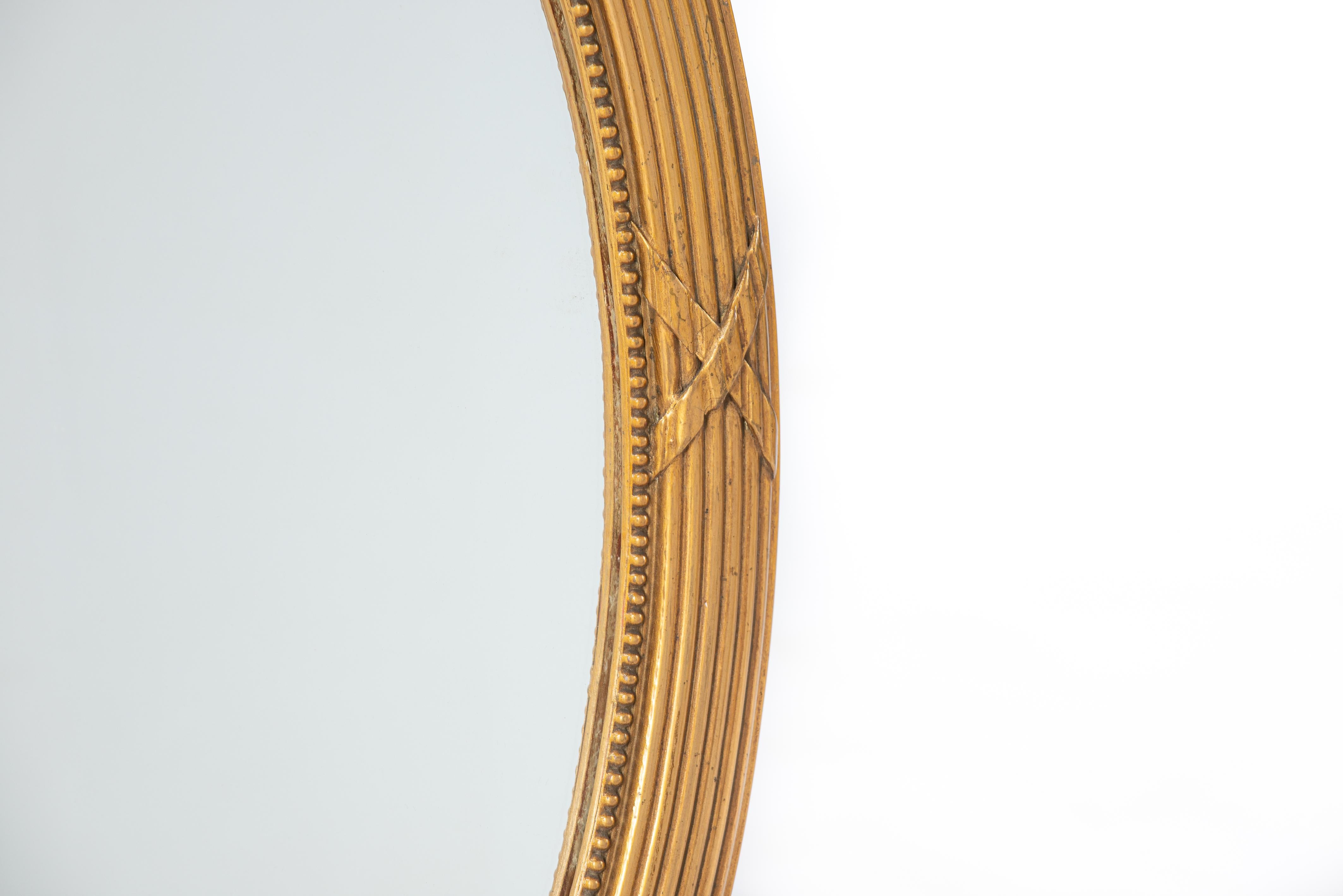Louis XVI Antique early 20th-century French gold gilt Louis seize or Empire oval mirror  For Sale