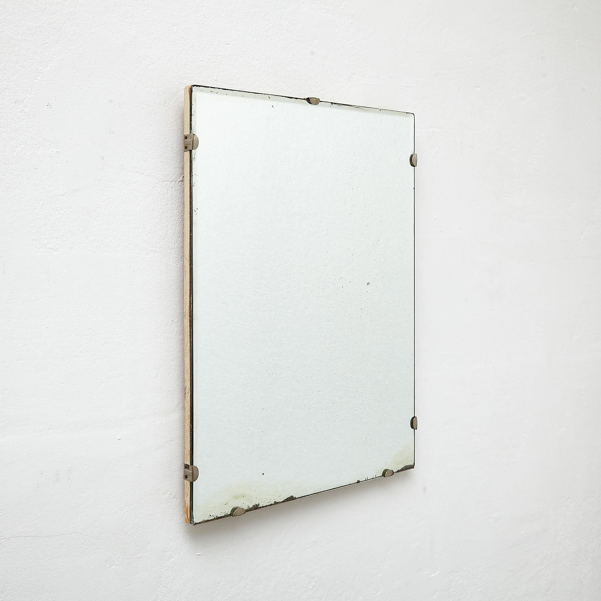 Antique Early 20th century French Wall Mirror.

Manufactured France, circa 1940.

Materials:
Wood, mirror

Dimensions: 
D 2 x W 42 cm x H 54 cm

In original condition, with minor wear consistent with age and use, preserving a beautiful