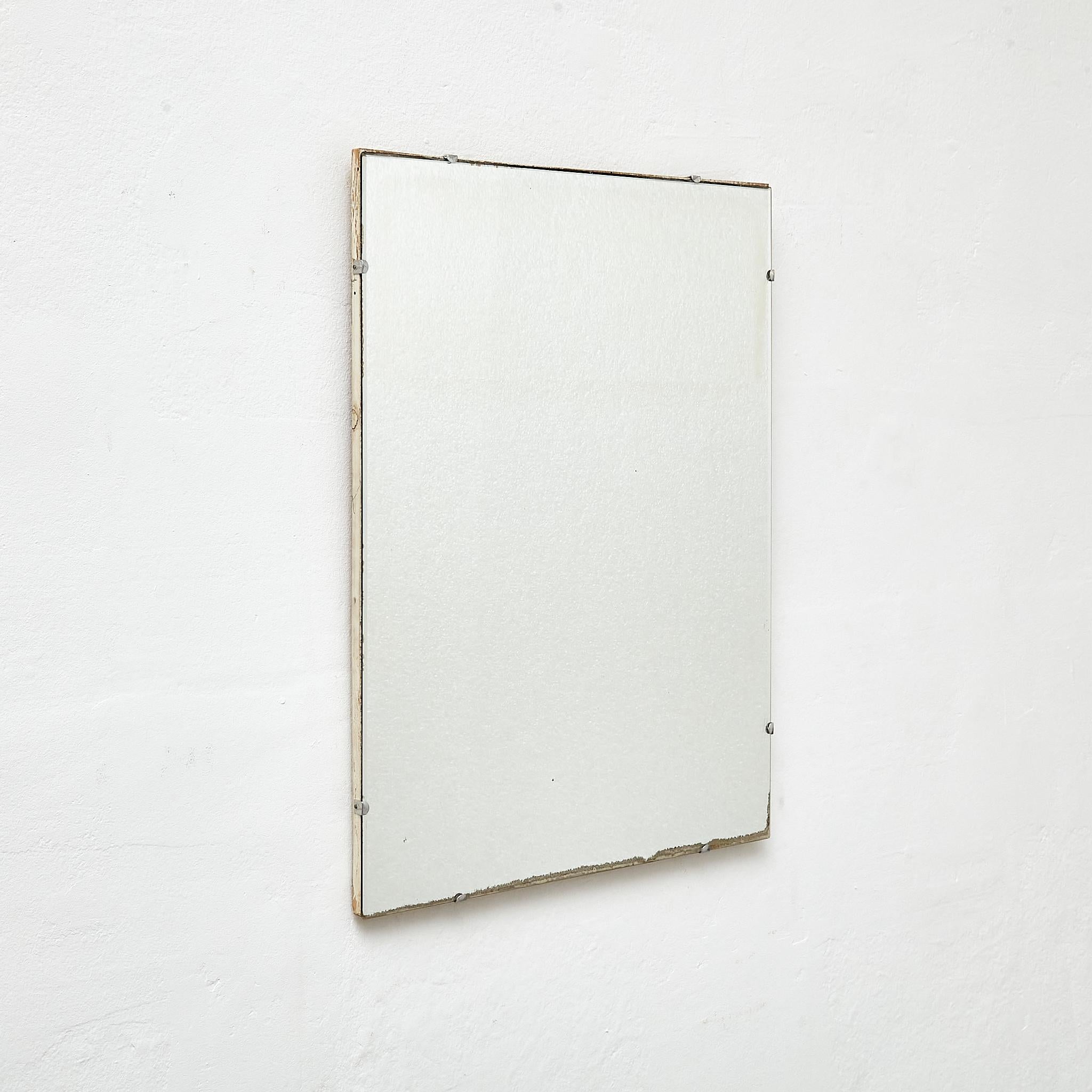 Antique Early 20th century French Wall Mirror.

Manufactured France, circa 1940.

Materials:
Wood, mirror

Dimensions: 
D 2 x W 45 cm x H 60.5 cm

In original condition, with minor wear consistent with age and use, preserving a beautiful