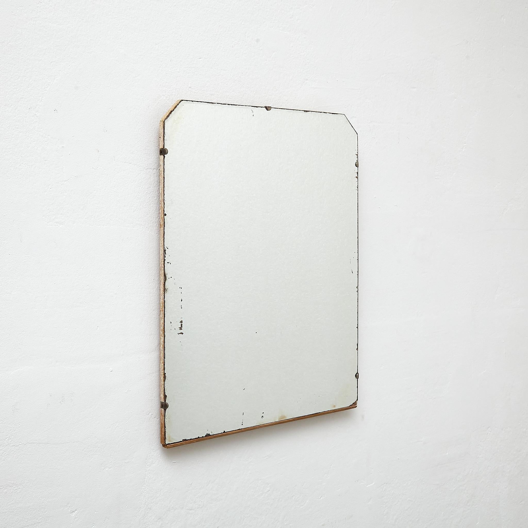 Antique Early 20th Century French Wall Mirror.

Manufactured France, circa 1940.

Materials:
Wood, mirror

Dimensions: 
D 1,3 x W 42.5 cm x H 55 cm

In original condition, with minor wear consistent with age and use, preserving a beautiful