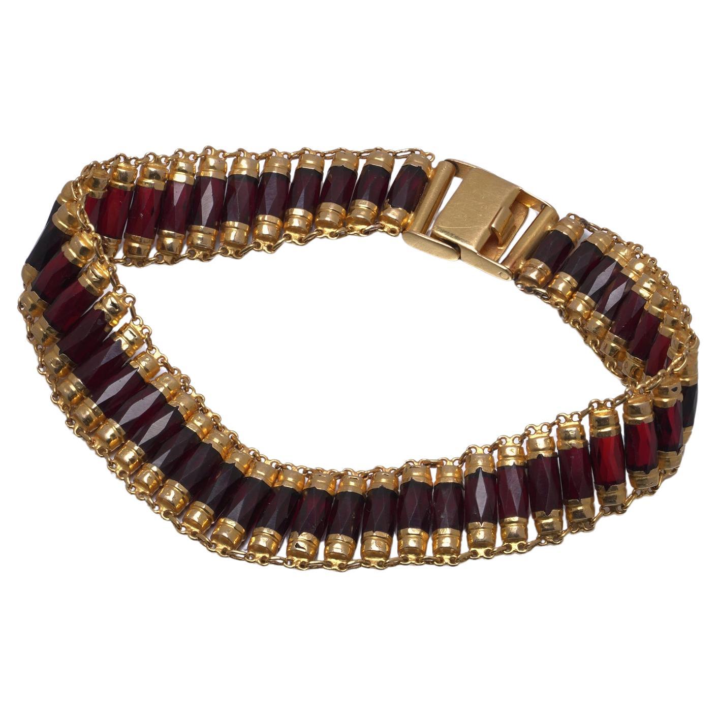 Antique early 20th-century gold bracelet set with garnet stones