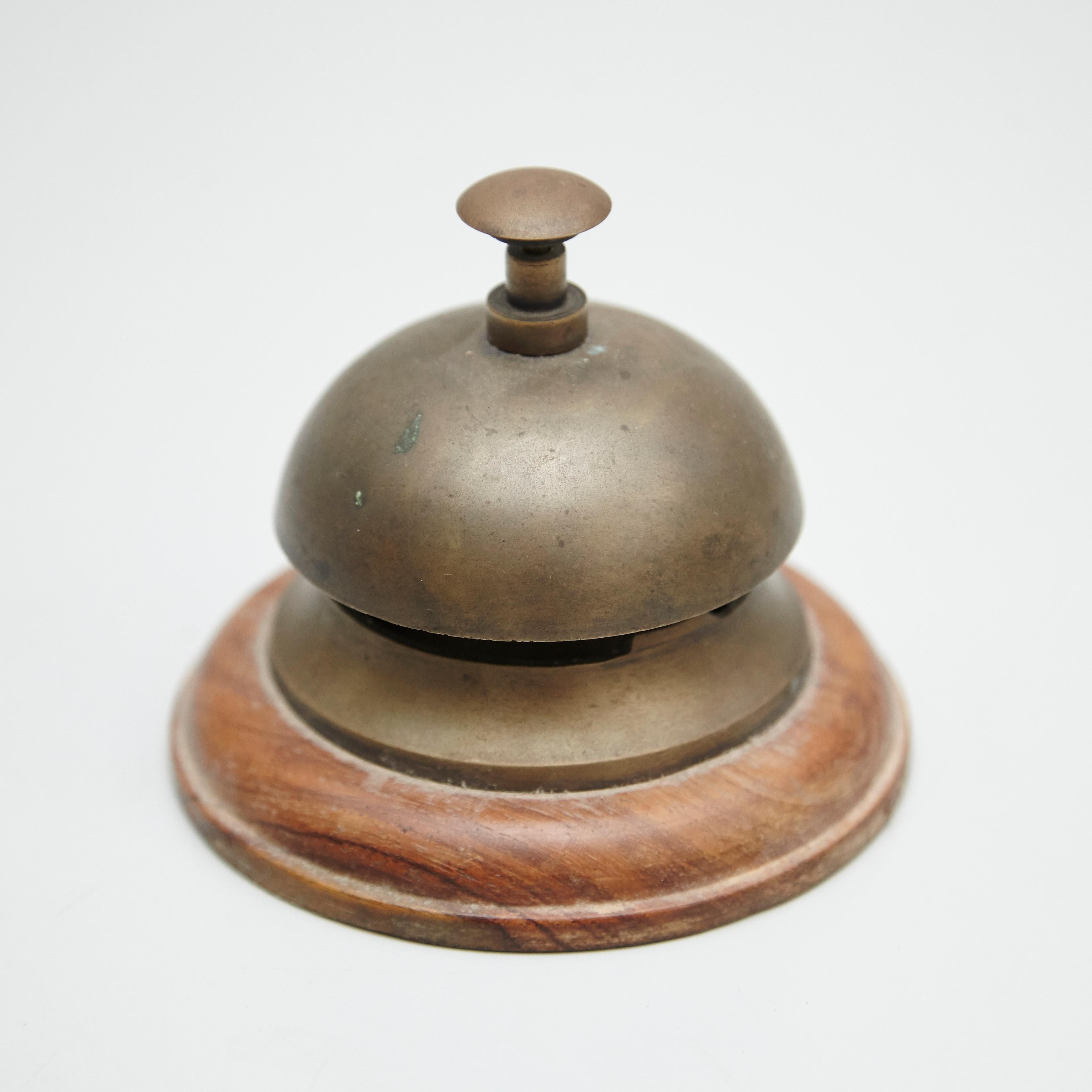 Antique early 20th century hotel bell
Brass and wood base.

circa 1920.

In original condition, with minor wear consistent of age and use.
 