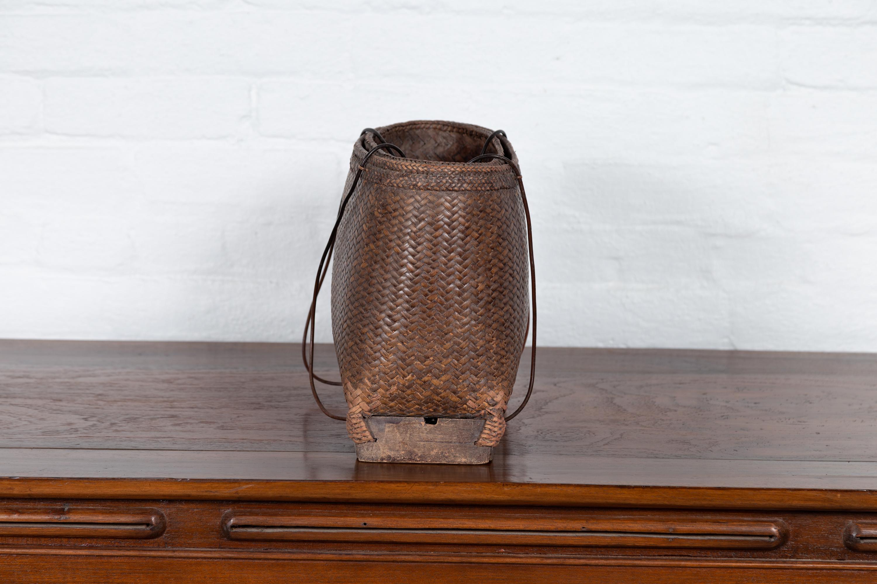 20th Century Small Rustic Hand-Woven Rattan Grain Basket from the Philippines
