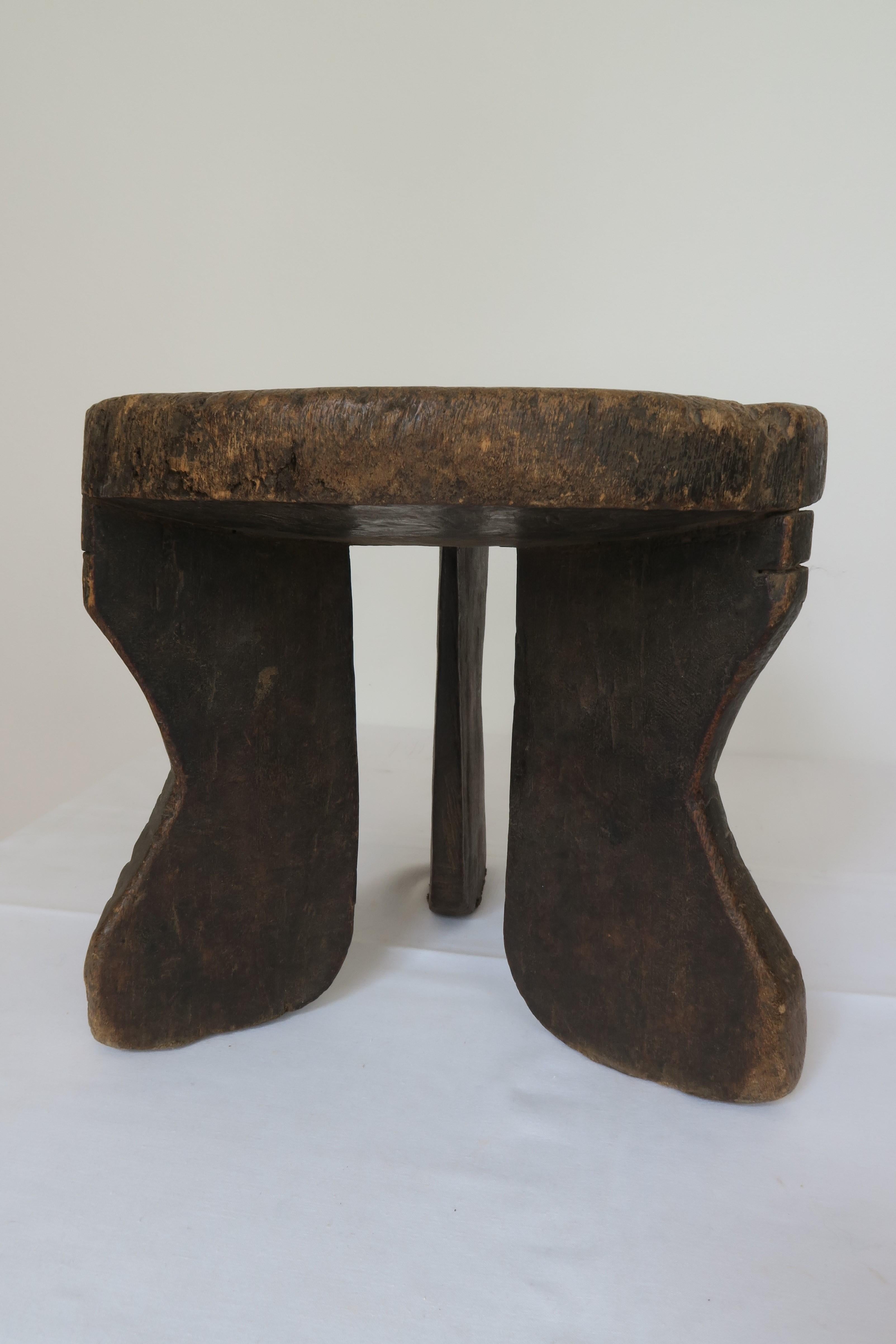 For sale is a graphic Hehe stool with three ridged legs and old patina.

The Hehe people lived in isolation on a highland in southwestern Tanzania, northeast of Lake Nyasa. With the exception of some pastoralists on the plains and some keeping a