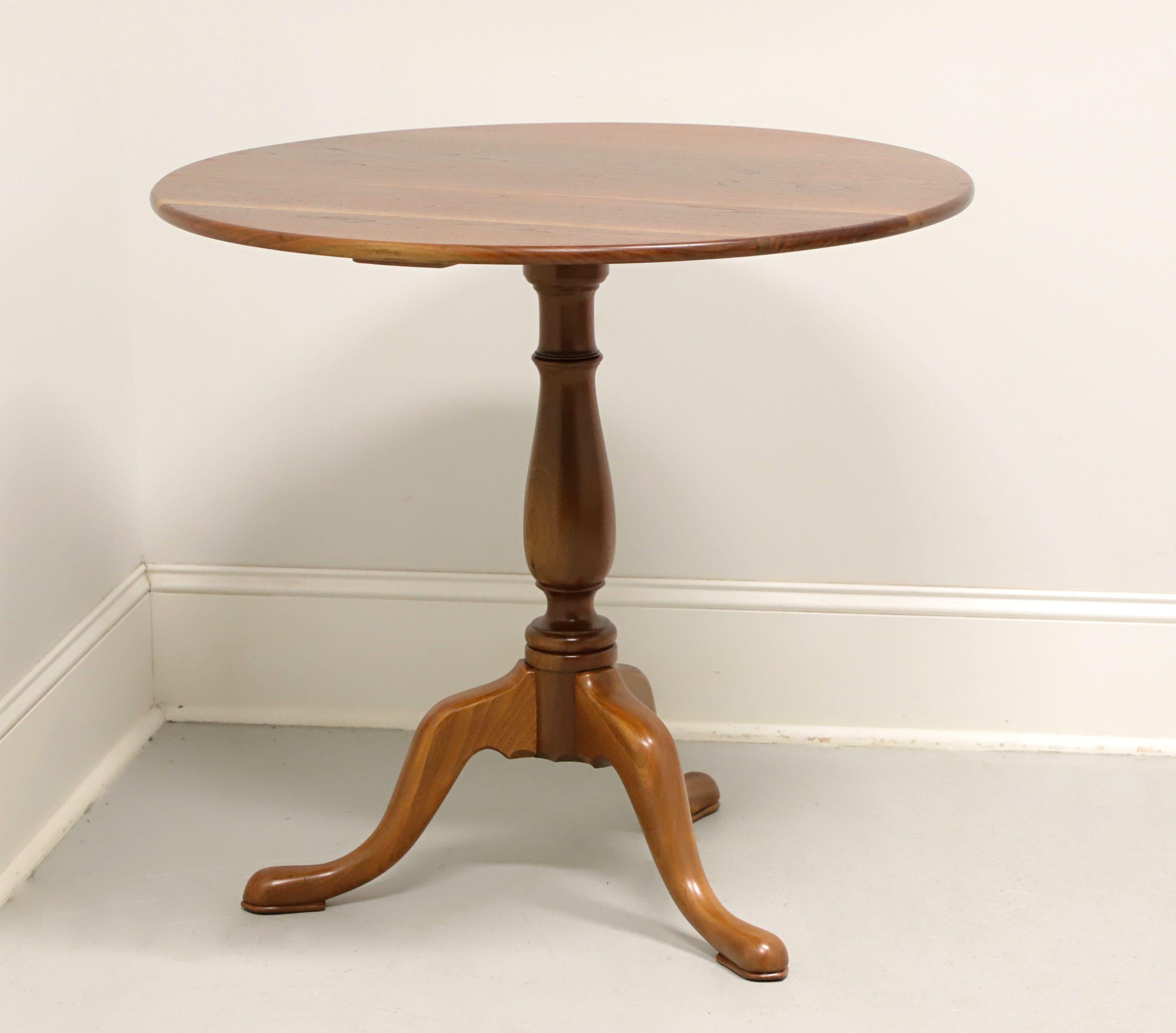 An antique Queen Anne style breakfast or center table, unbranded. Hand crafted of solid walnut with a light finish, smooth edge top, turned pedestal, three curved legs, and pad feet. Made in the USA, in the early 20th Century.

Measures: 32.25w