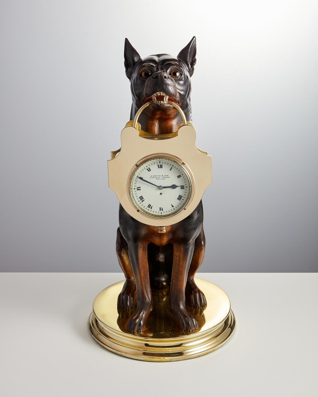 Antique Early 20th Century Wood Carving Of Doberman  Dog Carrying a Clock Circa 1900 Origin France

This Early 20th Century piece is well carved and in excellent condition with a good variation in colour.
The Clock has an English movement an is in