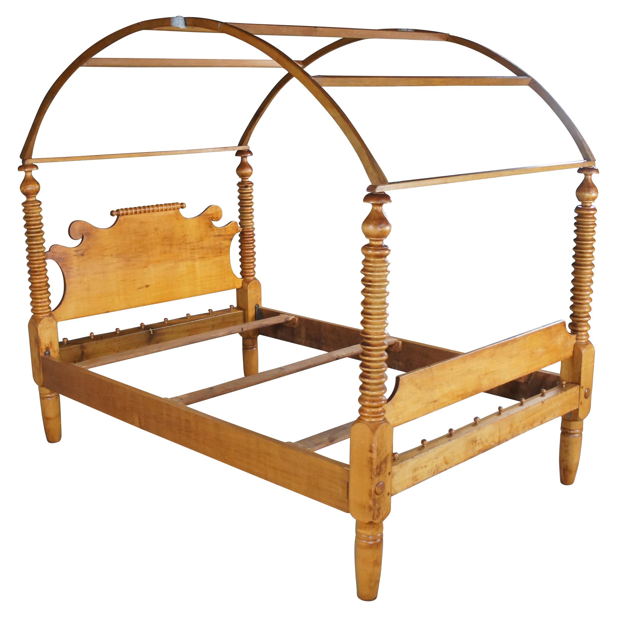 An impressive antique Jenny Lind rope / spool bed with canopy. Made from maple with turned and ribbed posts. The arched canopy can be removed for use without. The bed is supported by peg legs. A charming addition to any space.

DIMENSIONS

73.5