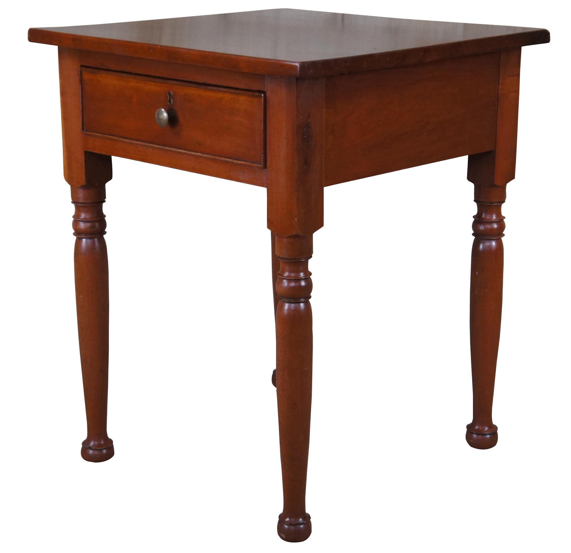 Antique American side or accent table. Made of cherry featuring square form, one upper drawer and turned legs. Measures: 27