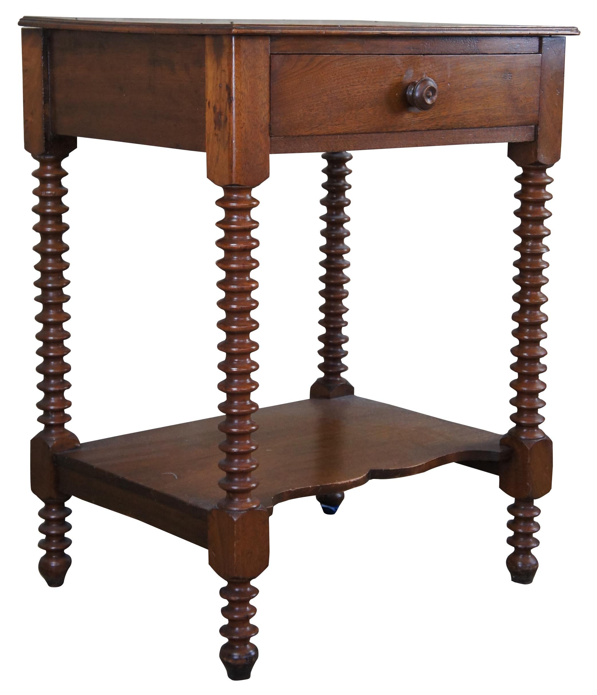 Antique early American two tier side accent table. Made of walnut featuring ribbed legs, serpentine lower shelf and one dovetailed drawer.
 