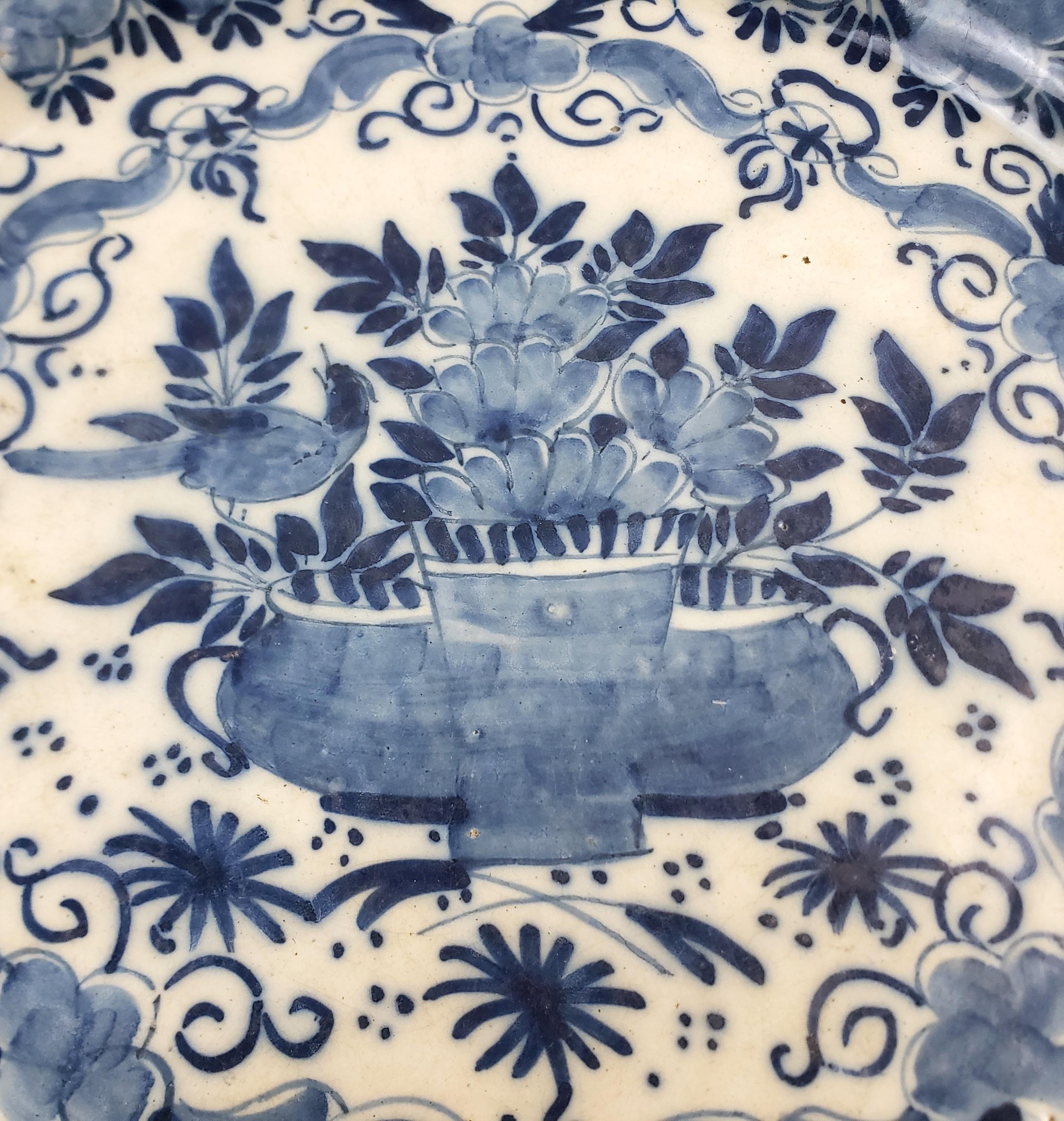 Hand-Crafted Antique Early Delftware Charger with Stylized Floral Decoration For Sale