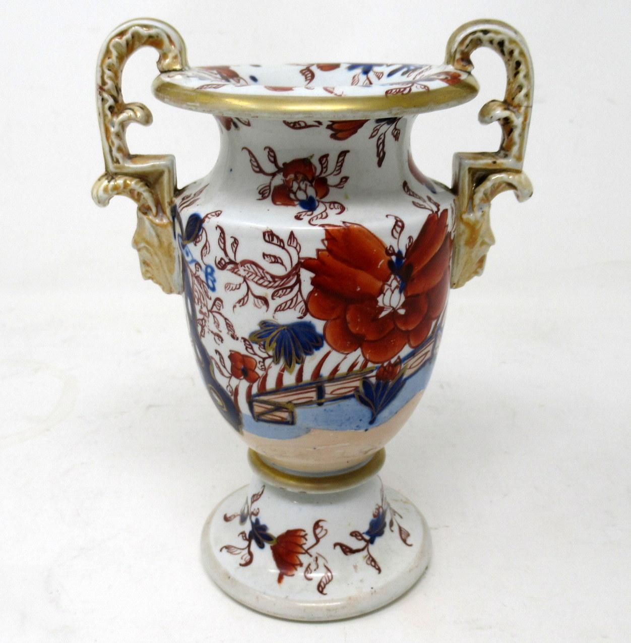 Rare example of an early English Chinoiserie Masons Ironstone China twin gilt handled Vase of compact proportions decorated in the Japan “Fence Pattern”, depicting flowers and foliage in colours of iron red and blues on a white ground. Octagonal