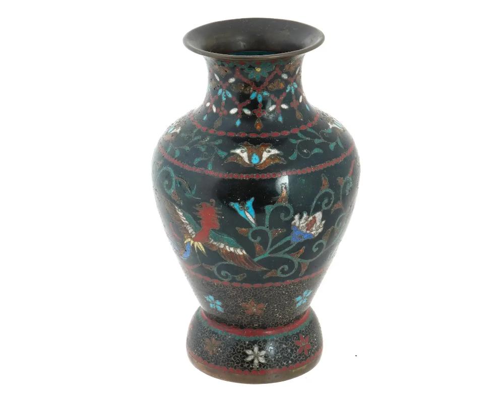 An antique Japanese early Meiji period cloisonne vase, attributed to the master artisan Namikawa Yasuyuki. Boasts a striking baluster shape adorned with phoenix birds, intricate foliage, and delicate bead motifs. The vase exemplifies Namikawas
