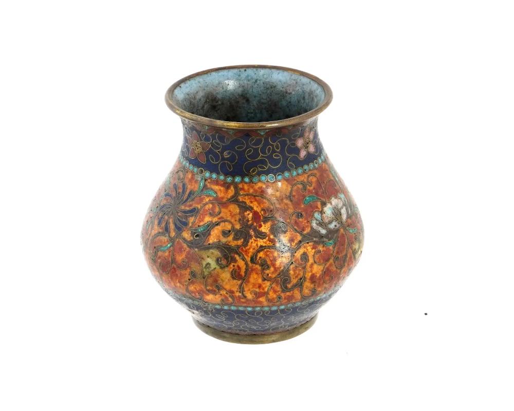 An antique Japanese early Meiji period cloisonne vase, attributed to the master artisan Namikawa Yasuyuki. Adorned with intricate foliate and floral patterns, complemented by delicate bead motifs, this vase embodies the hallmark precision and