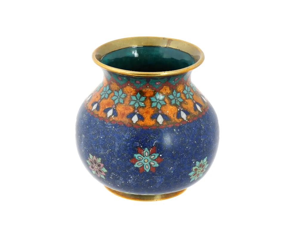 An antique Japanese early Meiji period cloisonne vase, attributed to the master artisan Namikawa Yasuyuki. Fashioned in a ball-shaped design, this vase is adorned with intricate floral motifs and delicate beadwork, showcasing the hallmark precision