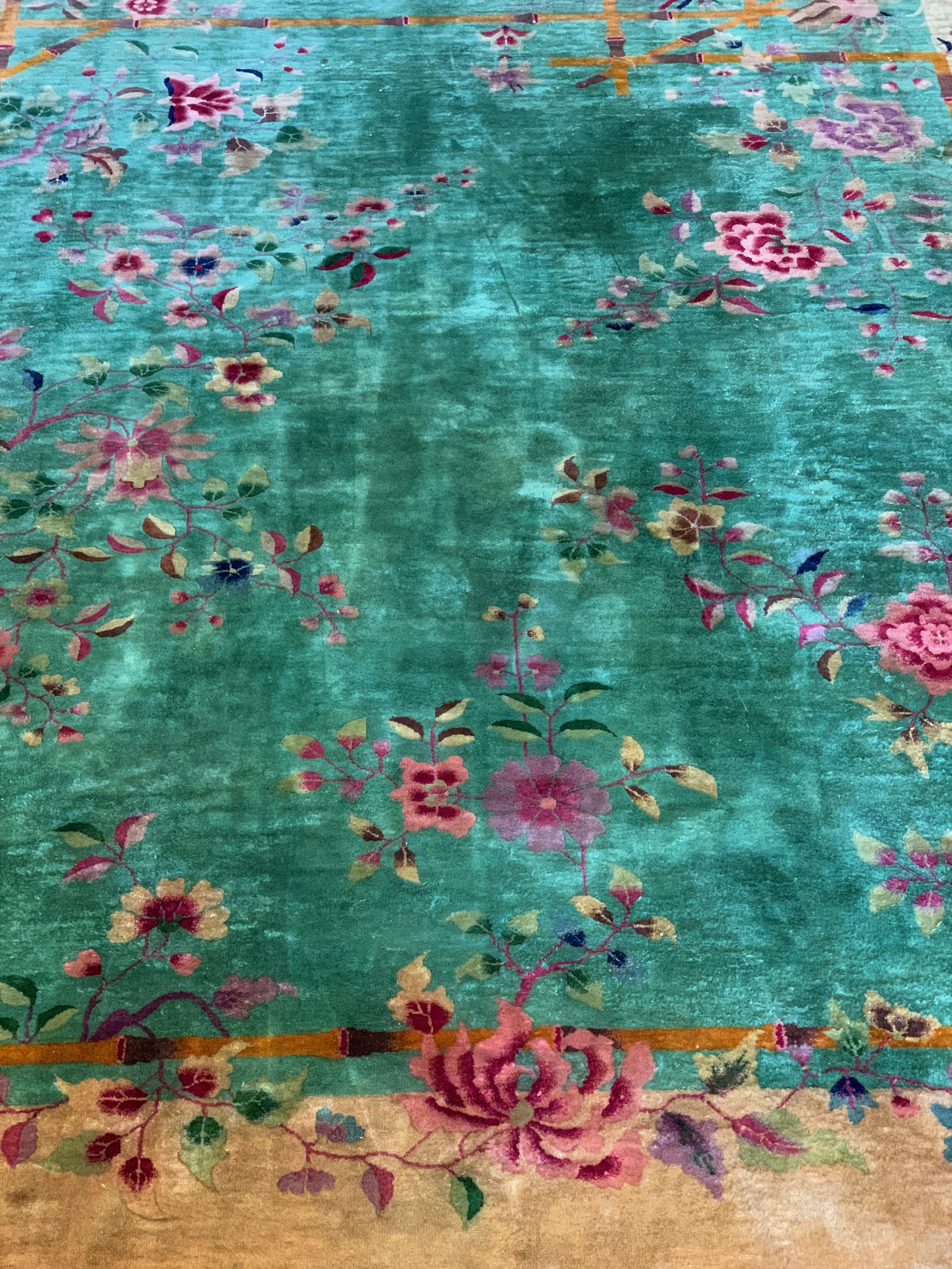 This is an authentic antique early Nichols Art Deco hand-knotted rug, made in China circa 1920. This rug is wool knots on cotton warp and weft, and is approximately 8’9 x 11’4. There are no damages and the pile is in great condition for its
