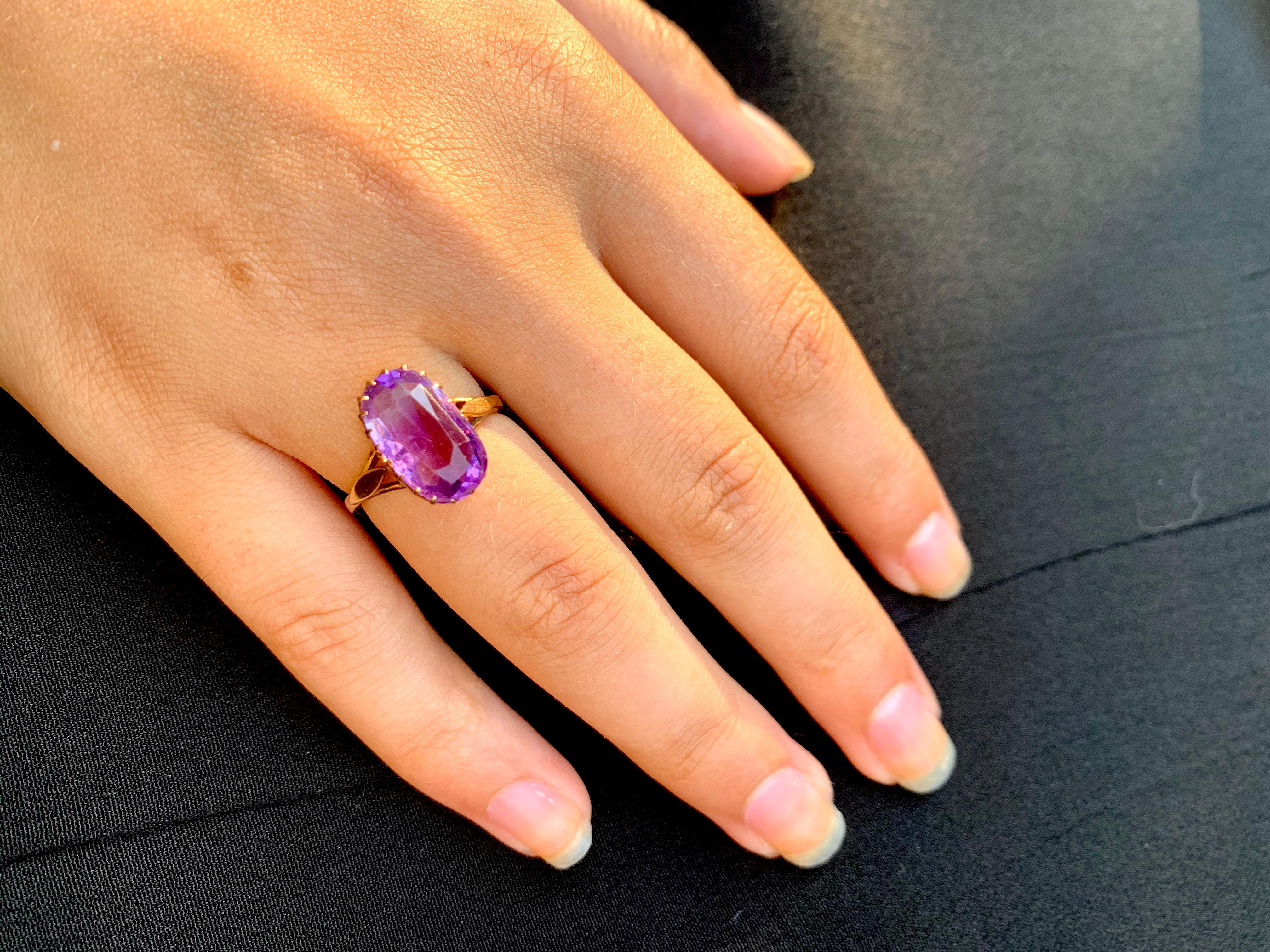 Romantic, delicate Old European cut amethyst ring in a lovely crown design 14K yellow gold setting. The unusual, slightly irregular cut on the lively amethyst immediately identifies this ring as a special, early piece. The stone measures 13mm by