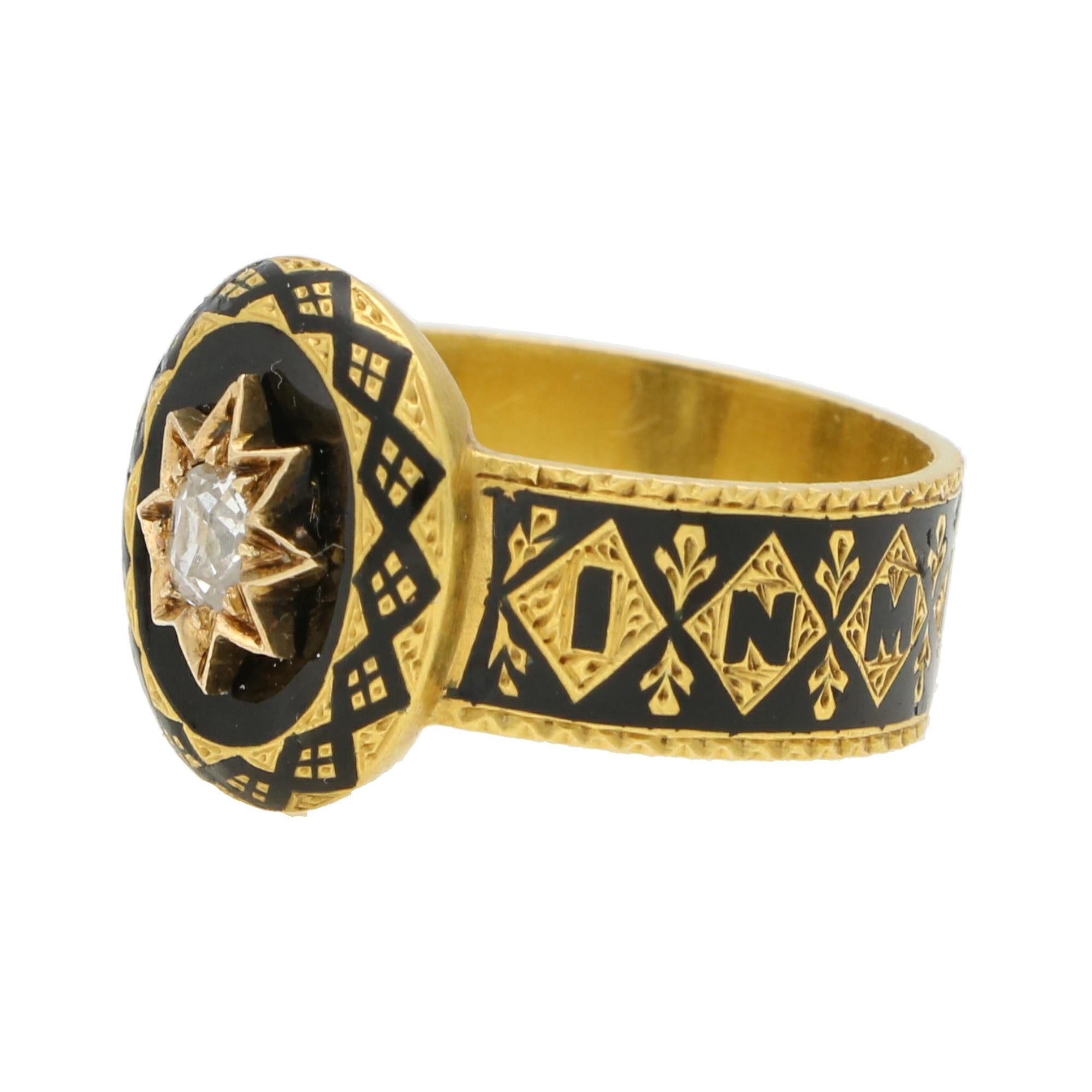 A one of a kind antique early Victorian black enamel and diamond mourning ring set in 18k yellow gold. 

The ring is composed of an oval plaque, set to the centre with a star motif with an old cushion cut diamond. The plaque has been hand enamelled