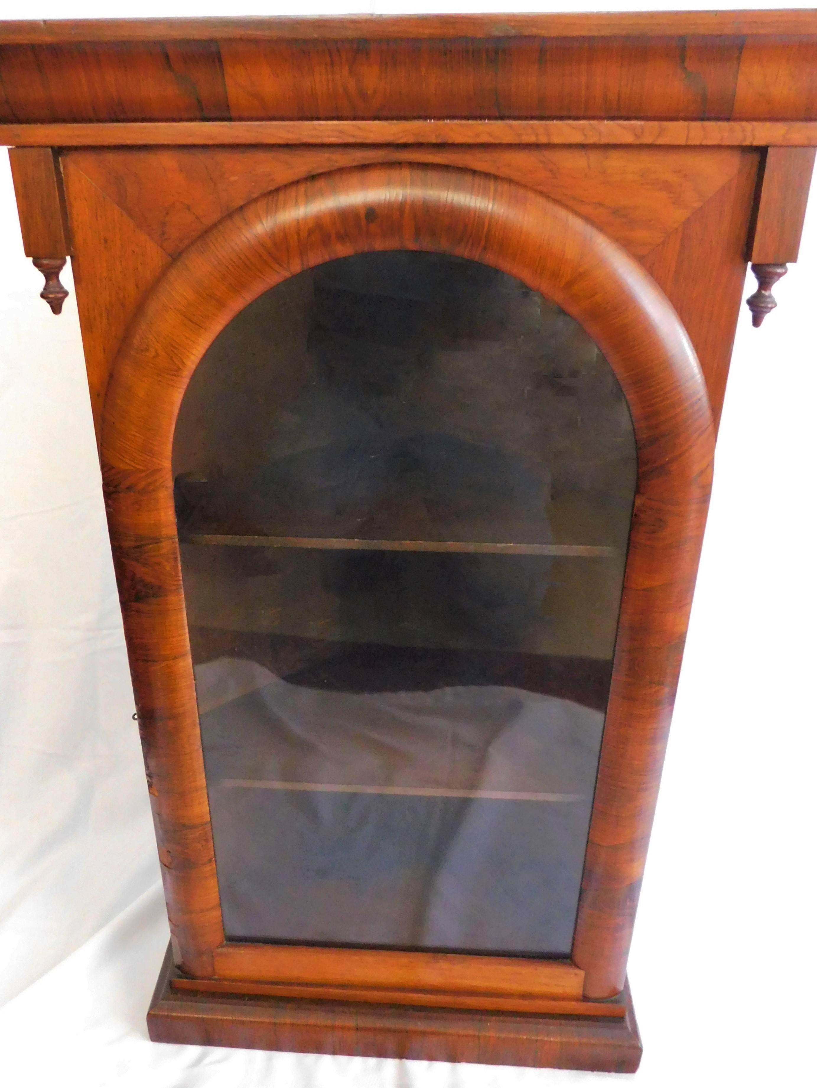 Early Victorian fruitwood veneer front corner cupboard with glass.