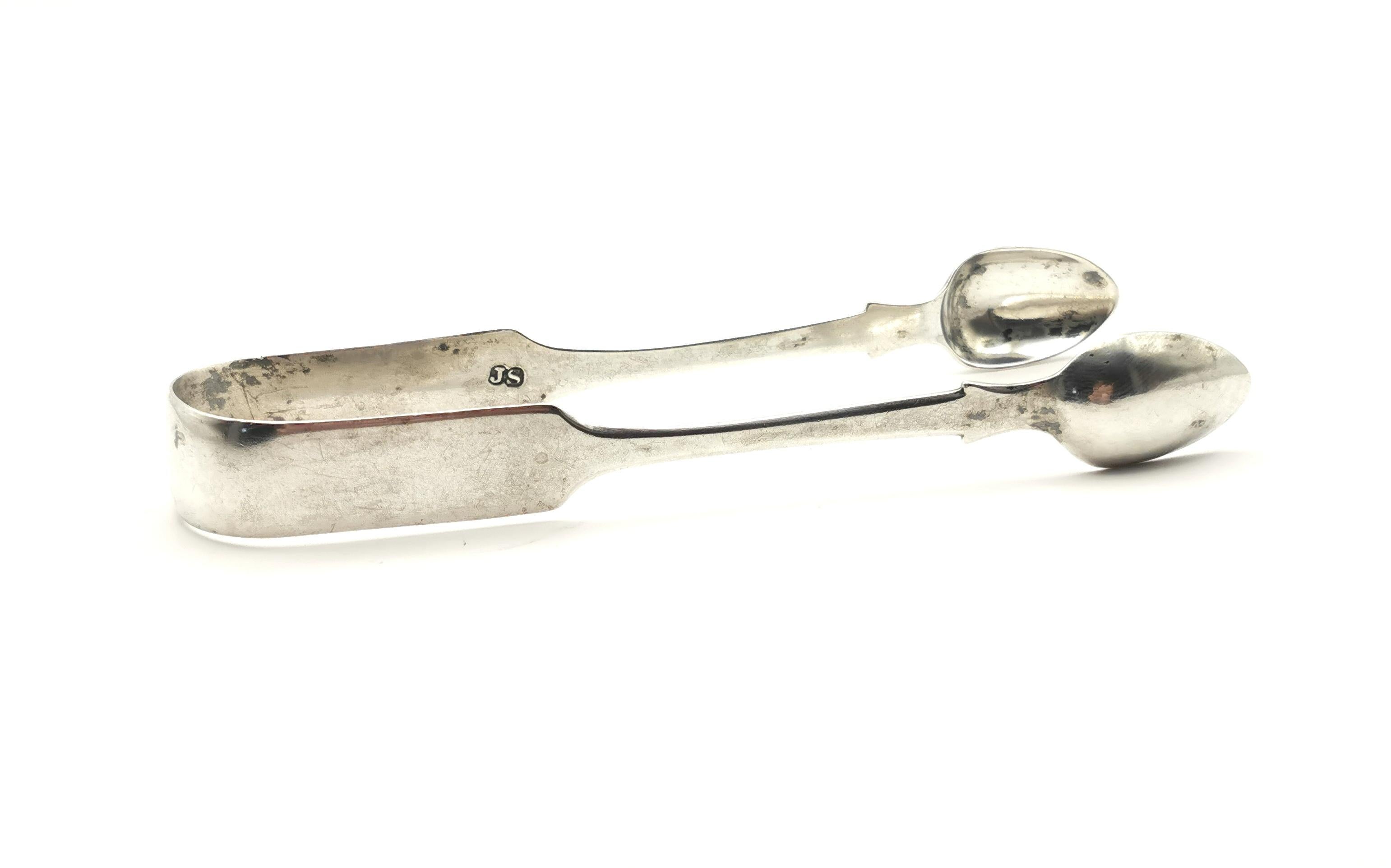A large pair of antique Victorian era sterling silver sugar tongs.

A relatively plain design, no engraving, they are substantial pair, large with a good weight to them.

They hail from Exeter which is a lesser seen hallmark than London or