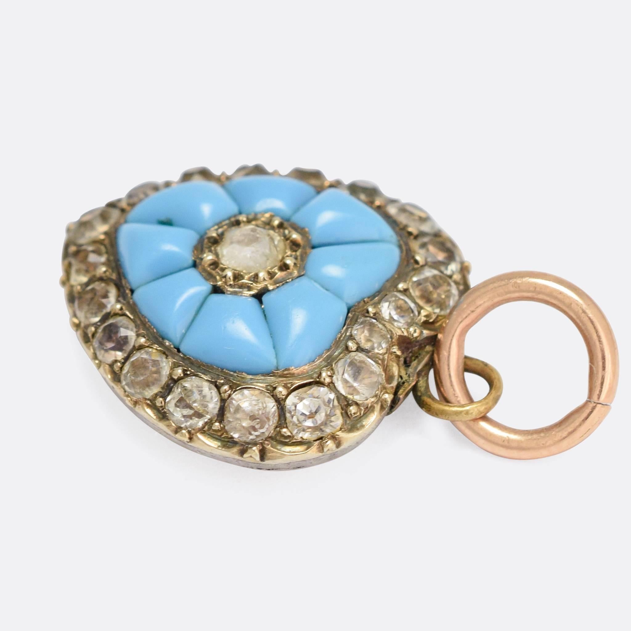 An adorable Victorian heart pendant, set with vibrant turquoise cabochons and bright white paste gems. The piece dates to c.1840, and remains in remarkably good condition - the foil-backed pastes still shine brightly, on account of the light