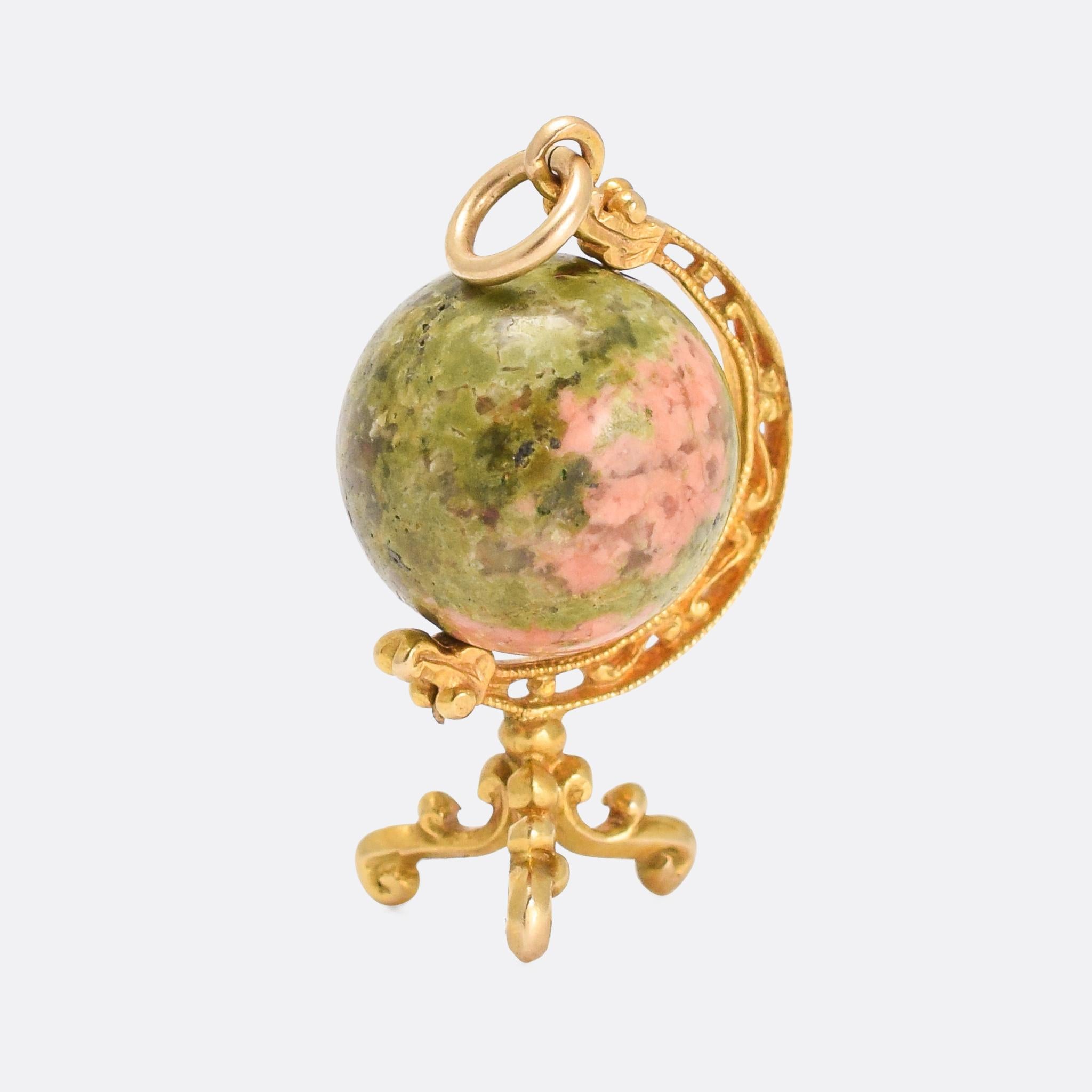 A cool and unusual antique globe pendant dating from the mid-19th Century. The Earth is represented by a sphere of green and pink unakite jasper, cleverly selected to that the pink parts look like the landmasses, and the green parts the oceans. The