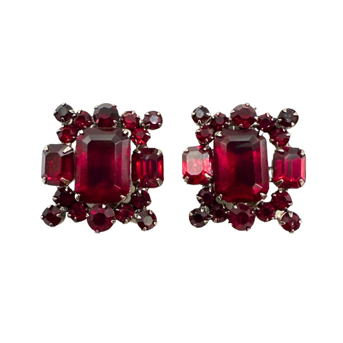 Earring Size: 1.22″ x 1.17″

Bin Code: E16 / P2

Capture the essence of vintage glamour with these Antique Earring Unsigned Julianna Multi-Shape Red Cut Glass Earrings. These exquisite earrings feature a stunning array of multi-shaped red cut glass