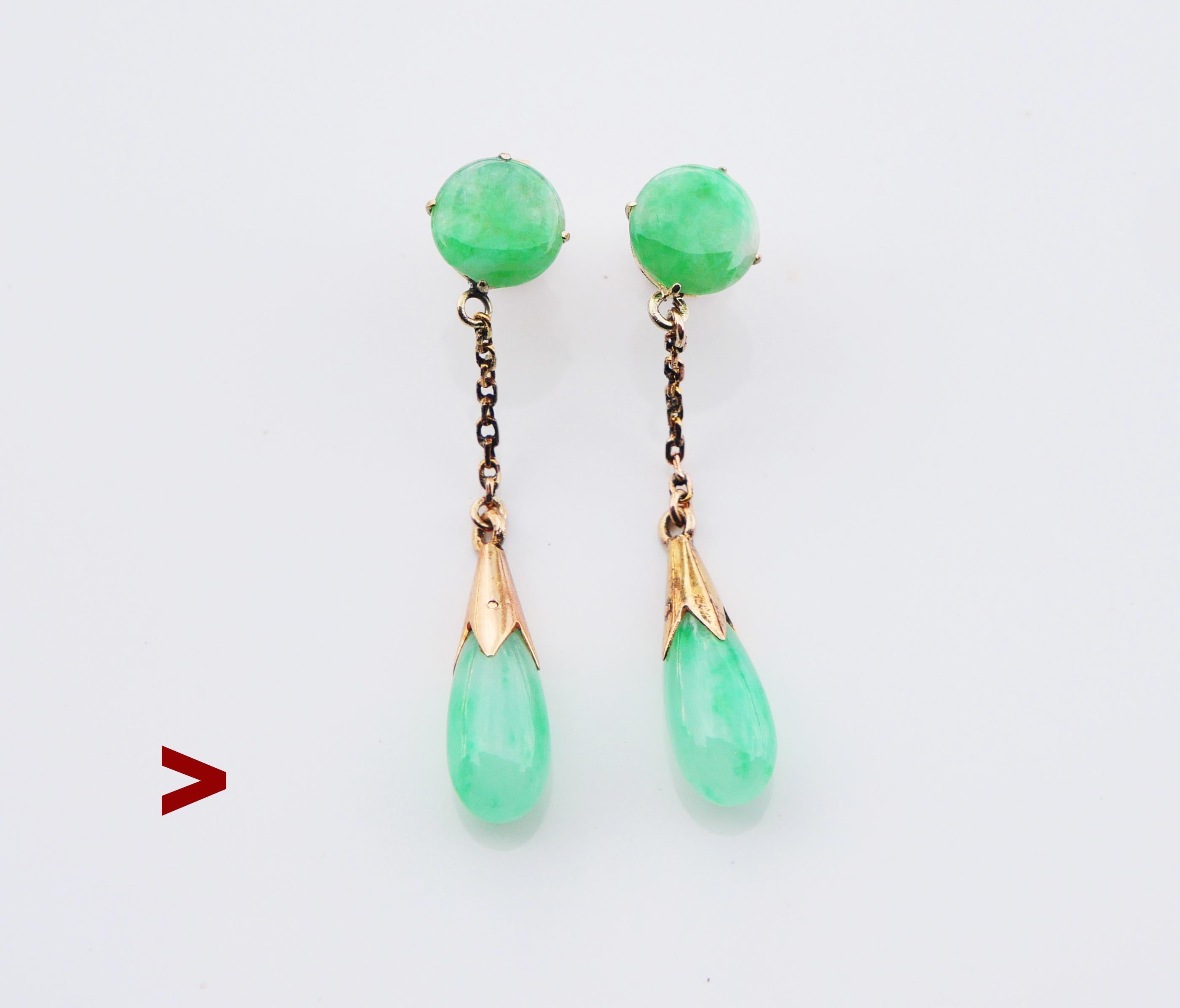A pair of nice German dangles, hand -made ca. 1930s in solid 14K Yellow Gold decorated with  natural translucent untreated Jade stones.

No hallmarks on earrings ,metal parts tested solid 14K Gold. Stoppers hallmarked 18K Gold. 

Each earring is