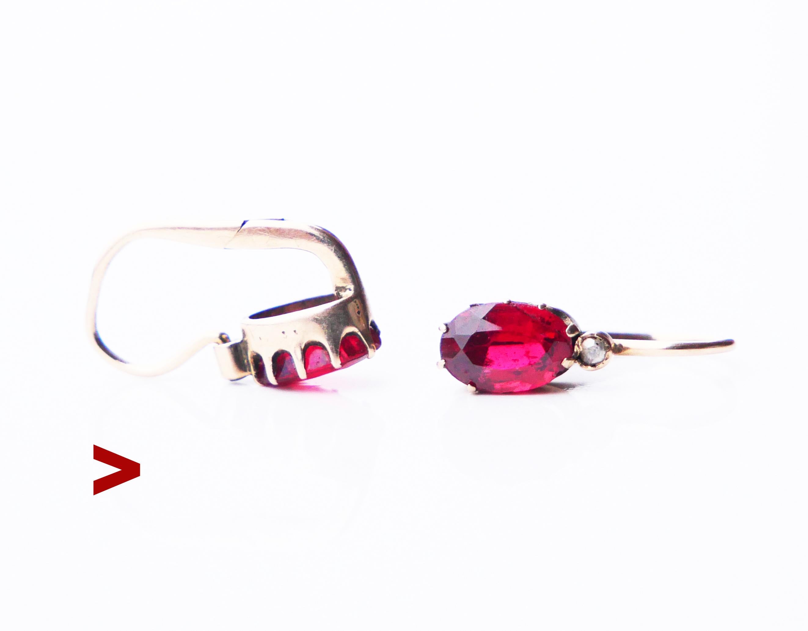 A pair of antique earrings with folding hooks decorated with oval cut Garnets 7 mm x 5 mm / ca. 0.8 ct each and rose cut Diamonds.

No hallmarks on both, metal tested solid 14K Gold. For several generations this pair was in possession of some