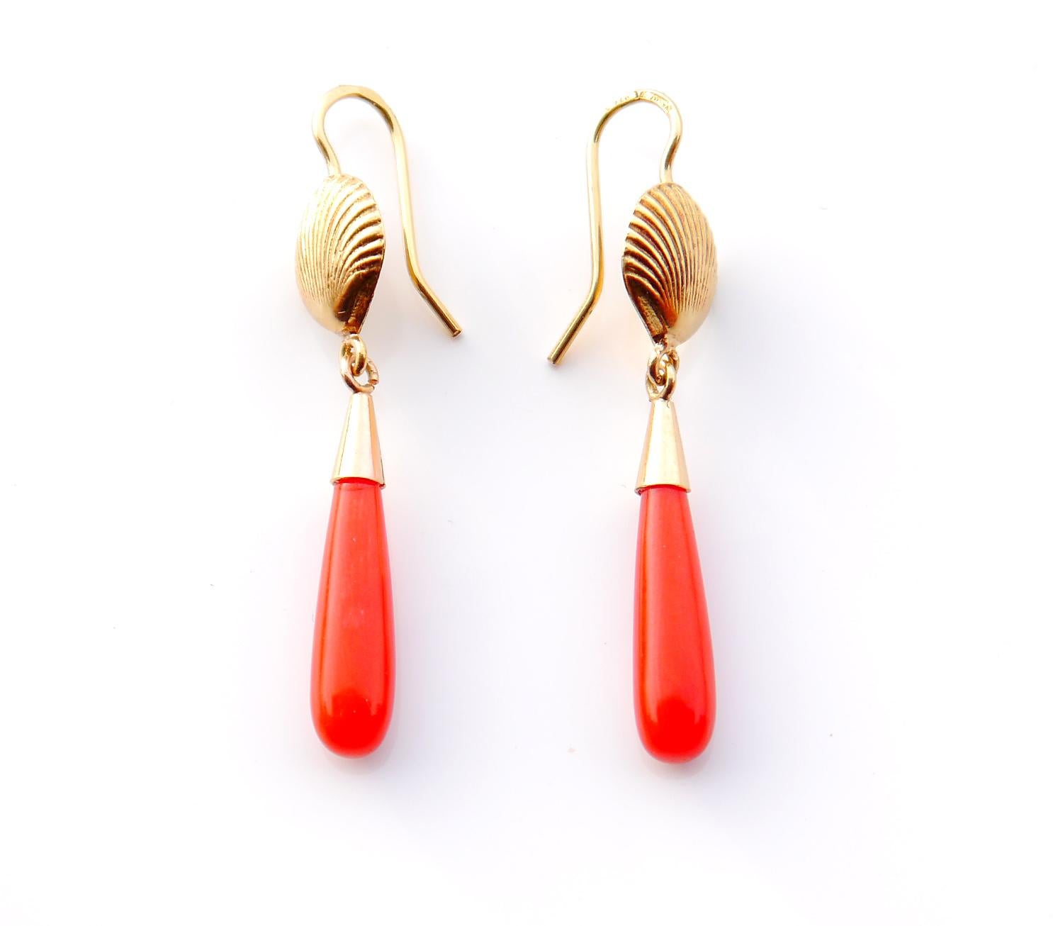 A pair of old European Earrings in solid 18K Yellow Gold with cast shells and suspended drops of natural /untreated Red Precious Coral settings.

Each earring is 45mm long including the hooks .Coral stones measures 17.5 mm long,color-dark