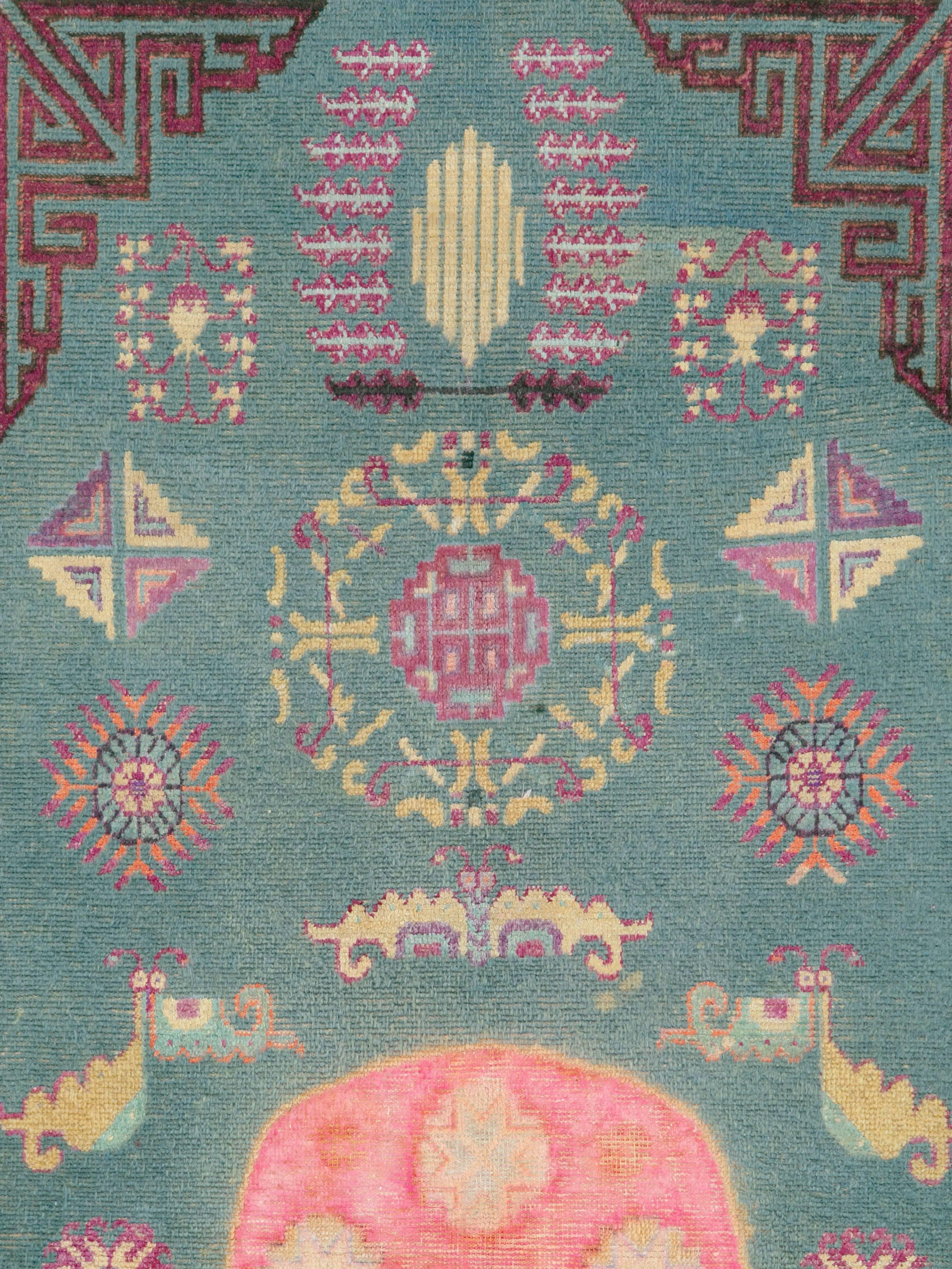 An antique Khotan rug from East Turkestan woven during the first quarter of the 20th century.