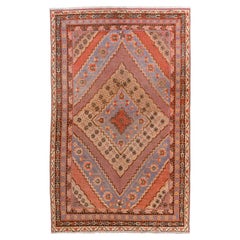 Antico tappeto Khotan del Turkestan orientale con morbidi medaglioni in lavanda e terracotta