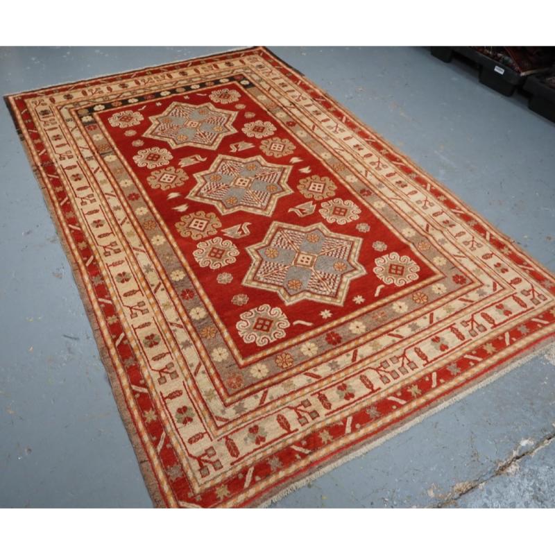 Antique Khotan rug from East Turkestan
Circa 1920

A striking rug of classic star medallion design from the city of Khotan in East Turkestan, formally known as Samarkand; the famous trading center on the silk road

The rug is in excellent condition