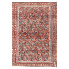 Ancien tapis Belouch de Turquie orientale avec un riche motif de treillis rouge