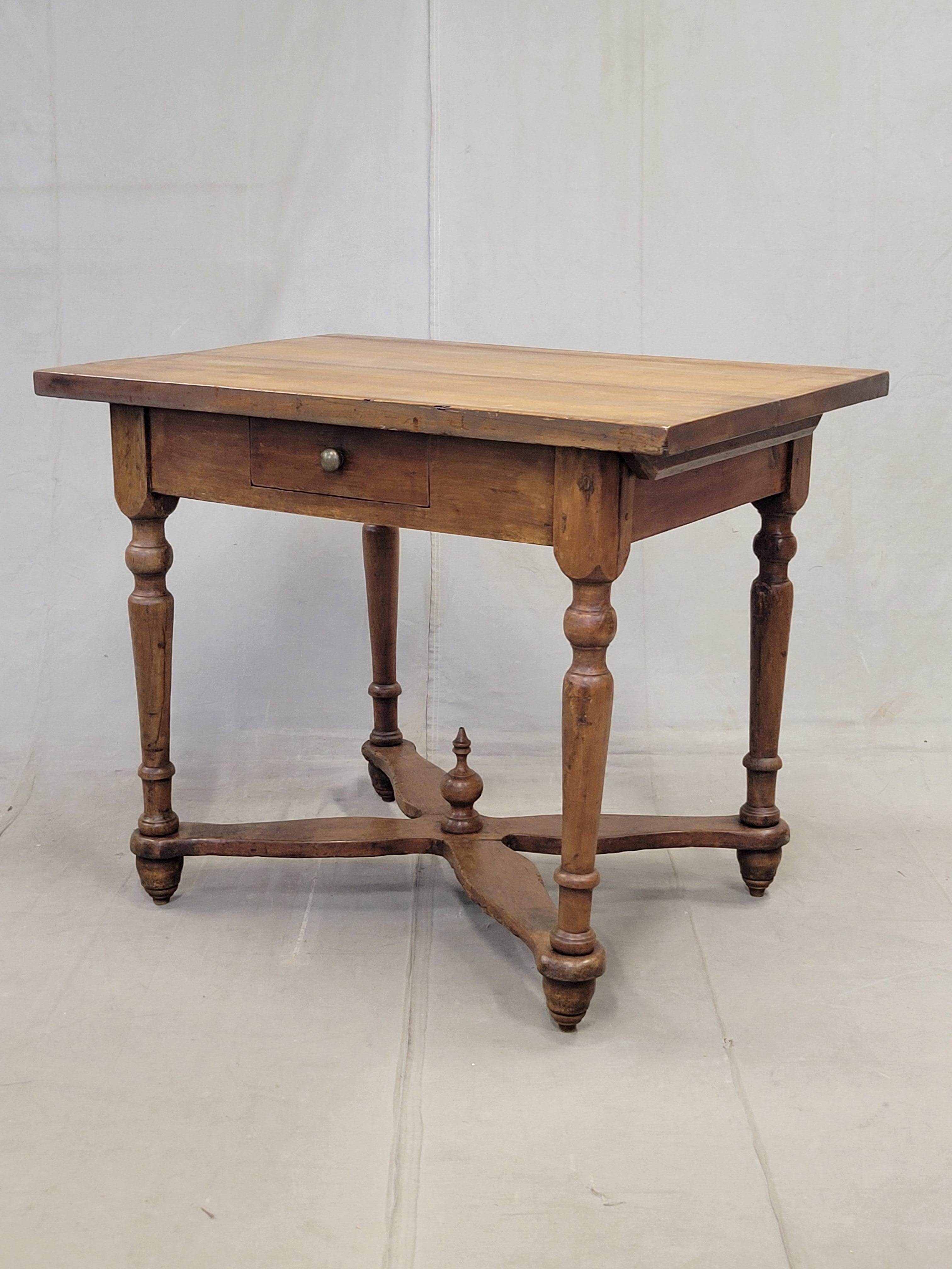 A charming antique Eastern European, possibly Hungarian, baker's table that is perfect for modern use as a kitchen island. It stands 34