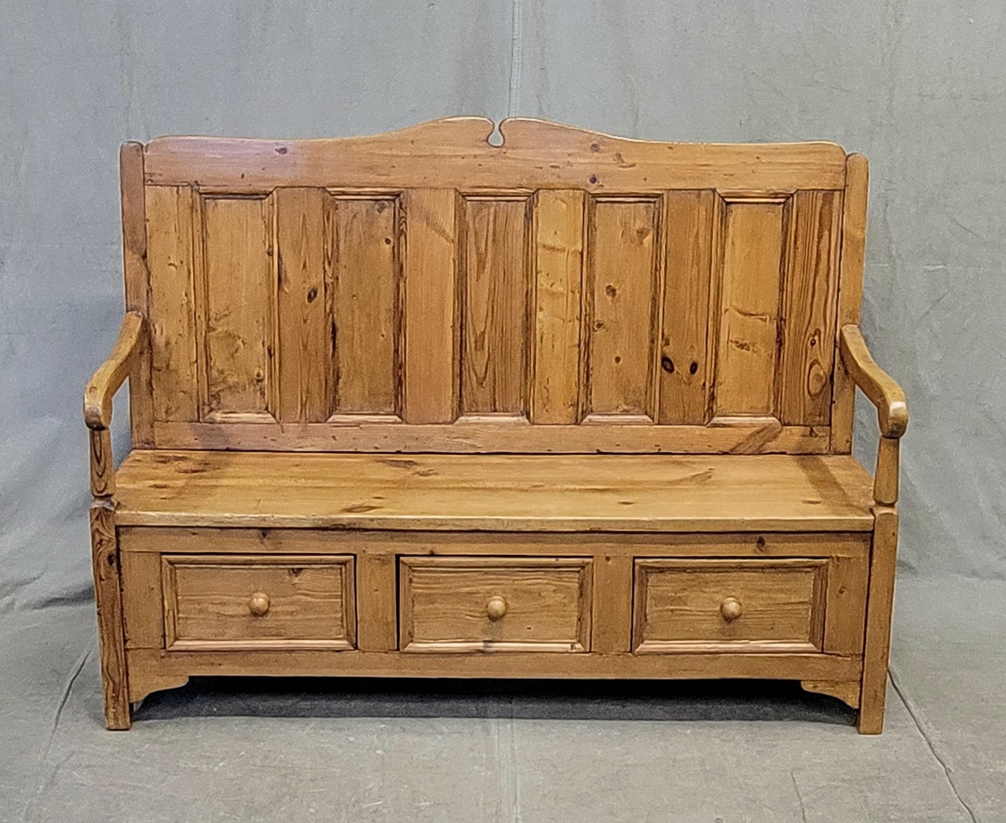 An absolutely beautiful rustic pine settle bench with three drawers made in Poland. Strong and sturdy, ready for many years of enjoyment. The waxed finish just glows! Use next to a pine farmhouse table for seating or in an entryway for sitting down