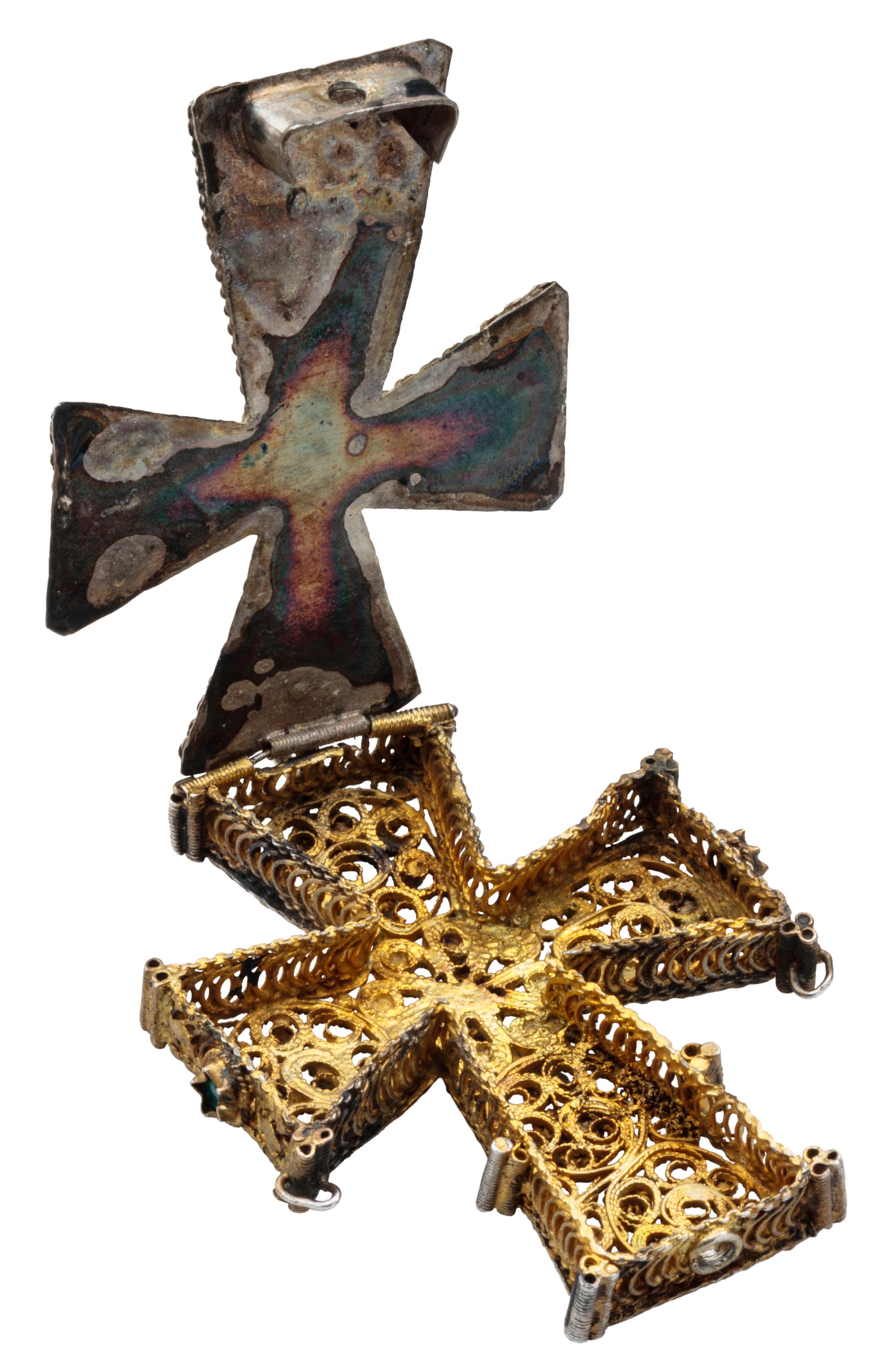 RELIQUARY CROSS PENDANT 
Balkans (probably Bulgaria), 18th-19th century 
Gilded silver, glass pastes 
Weight 40.7 grams; dimensions 74 × 15 × 10 mm

Double-sided pendant made of gilded silver filigree in the shape of a Greek cross, with pendant