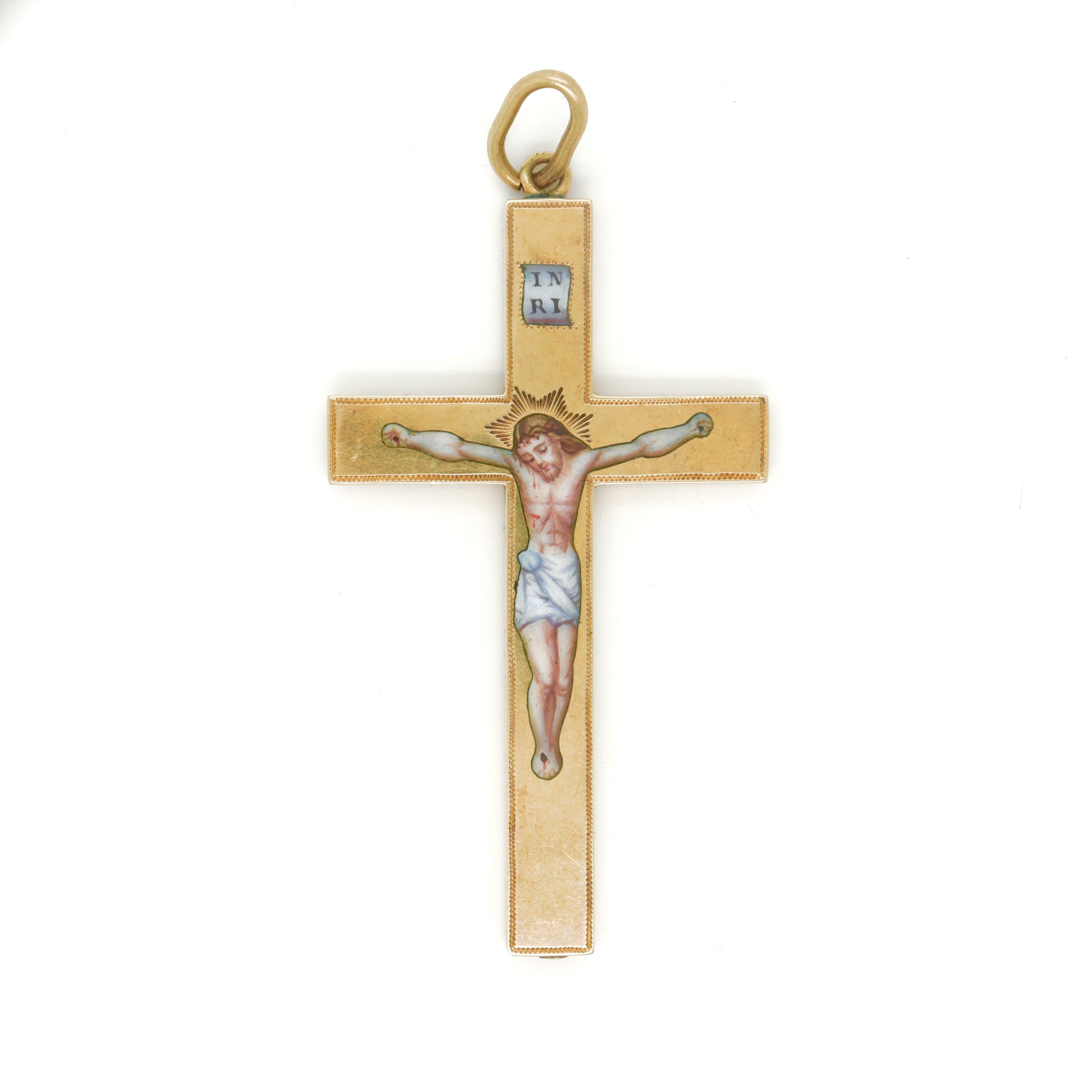 A fine antique gold and enamel crucifix.

In 14k gold.

With an enameled depiction of Christ and the Titulus Crucis (title of the cross).

Likely Eastern Orthodox in origin.

With an integral bail and attached jump ring.

Simply a wonderful crucifix