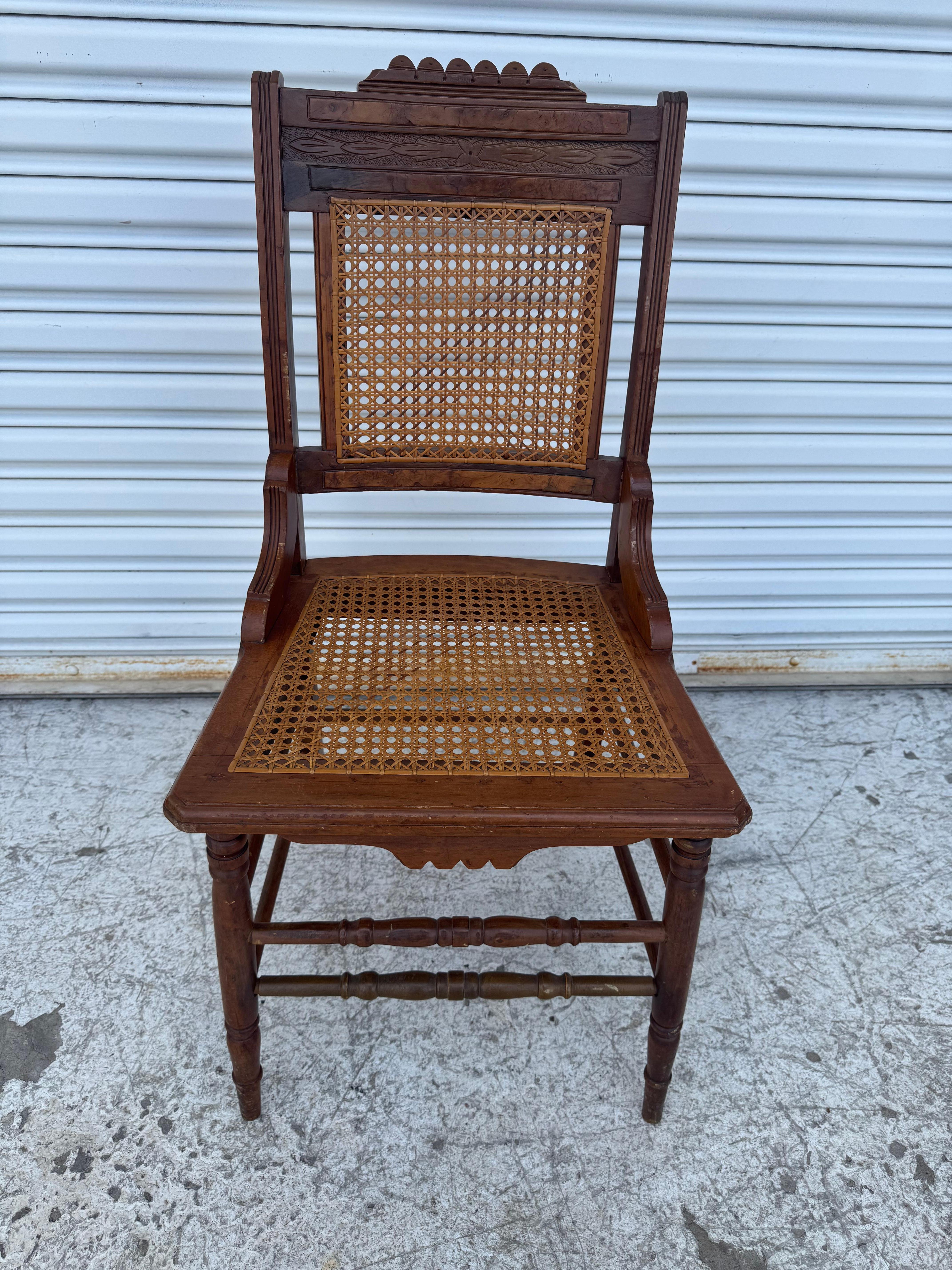 Antique cane seat and back, carved mahogany and walnut veneer wood parlor or side chair.
Dimensions:
Length: 15.75