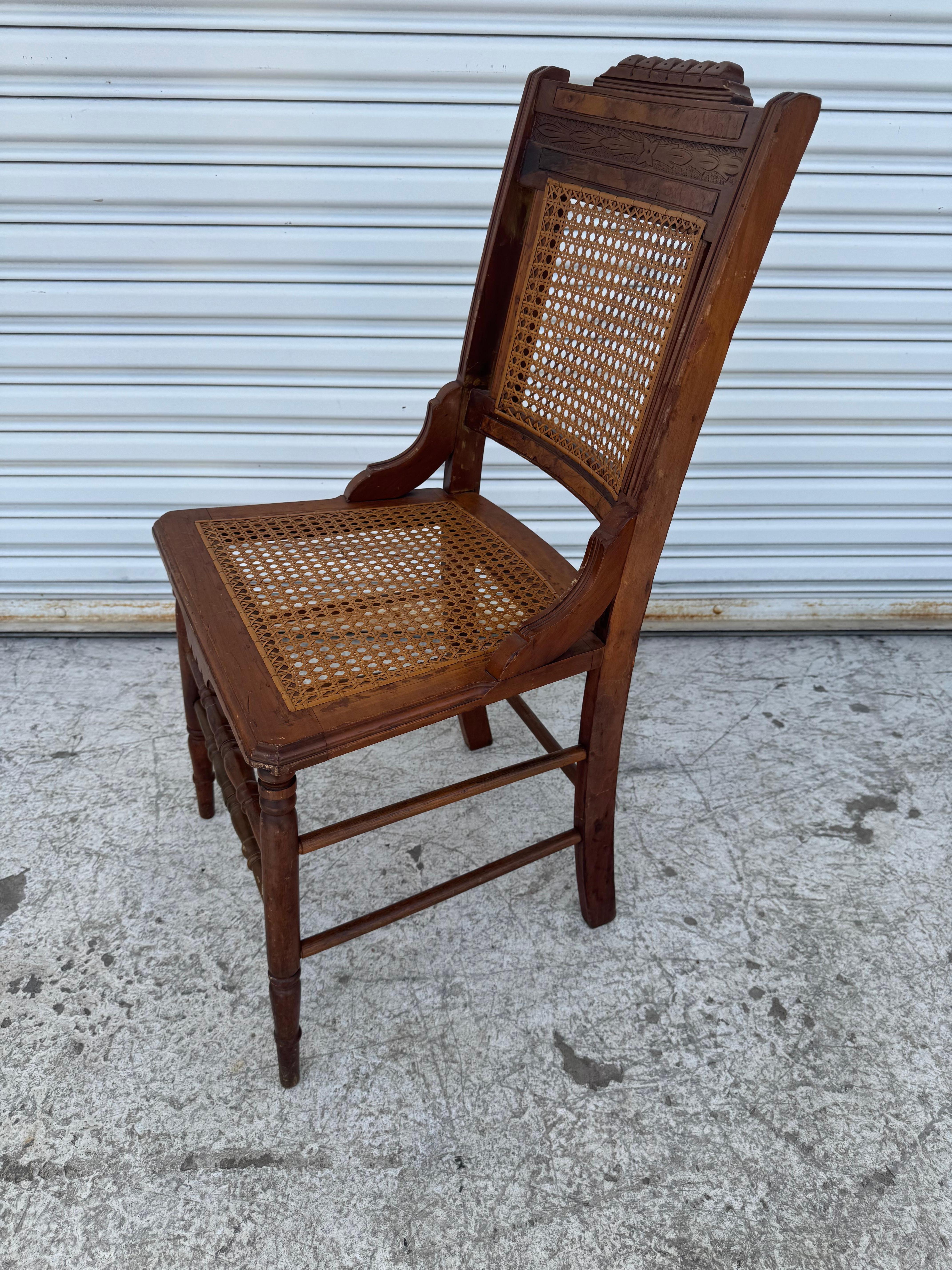 Fine XIX secolo Antique Eastlake Carved Walnut and Cane Parlor Chair in vendita