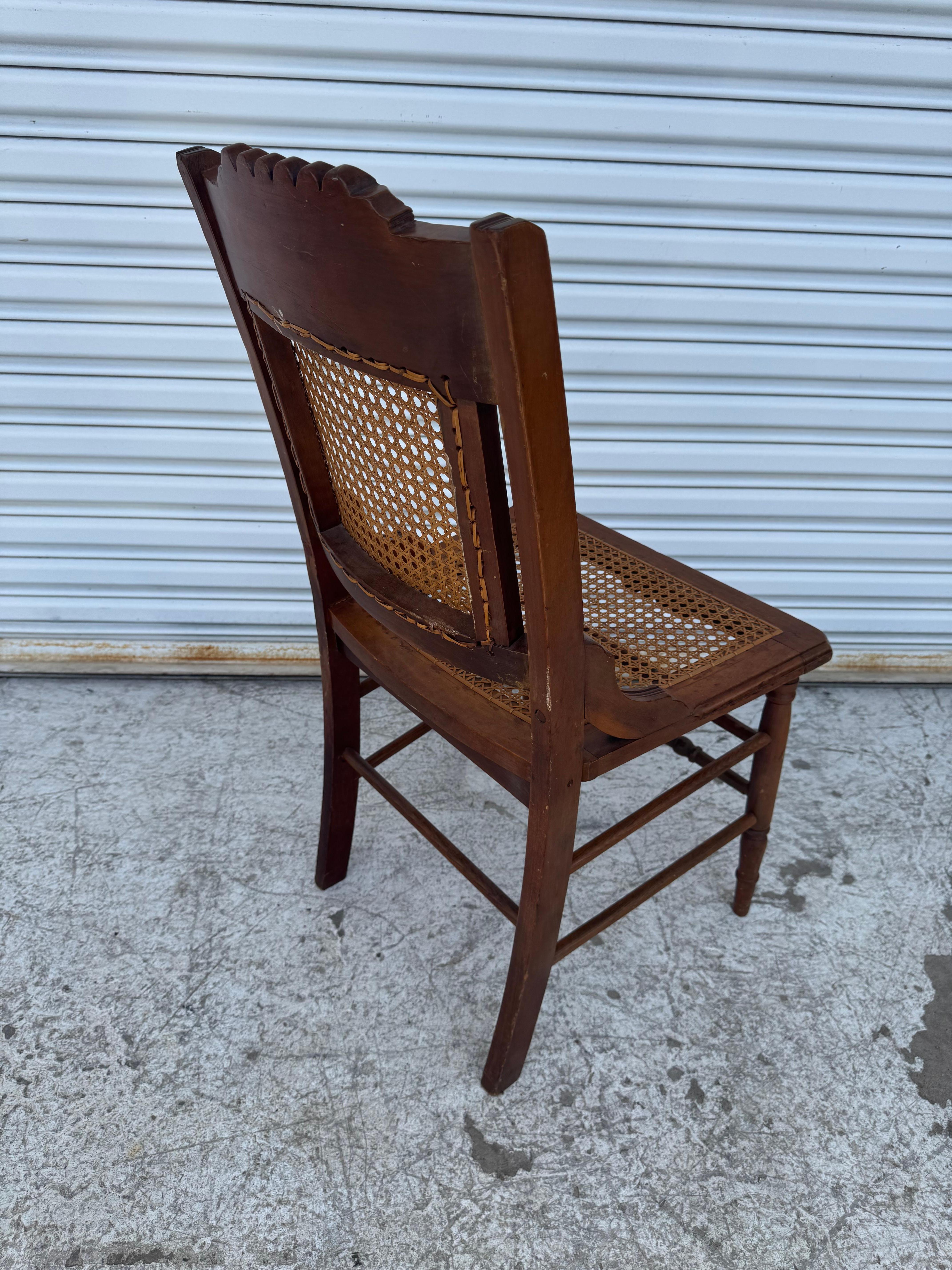 Canna Antique Eastlake Carved Walnut and Cane Parlor Chair in vendita