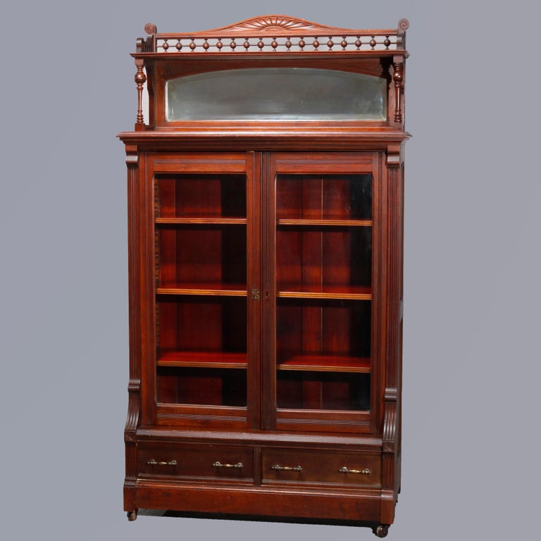 Antique Eastlake Carved Walnut Mirrored TwoDoor Bookcase, circa 1890