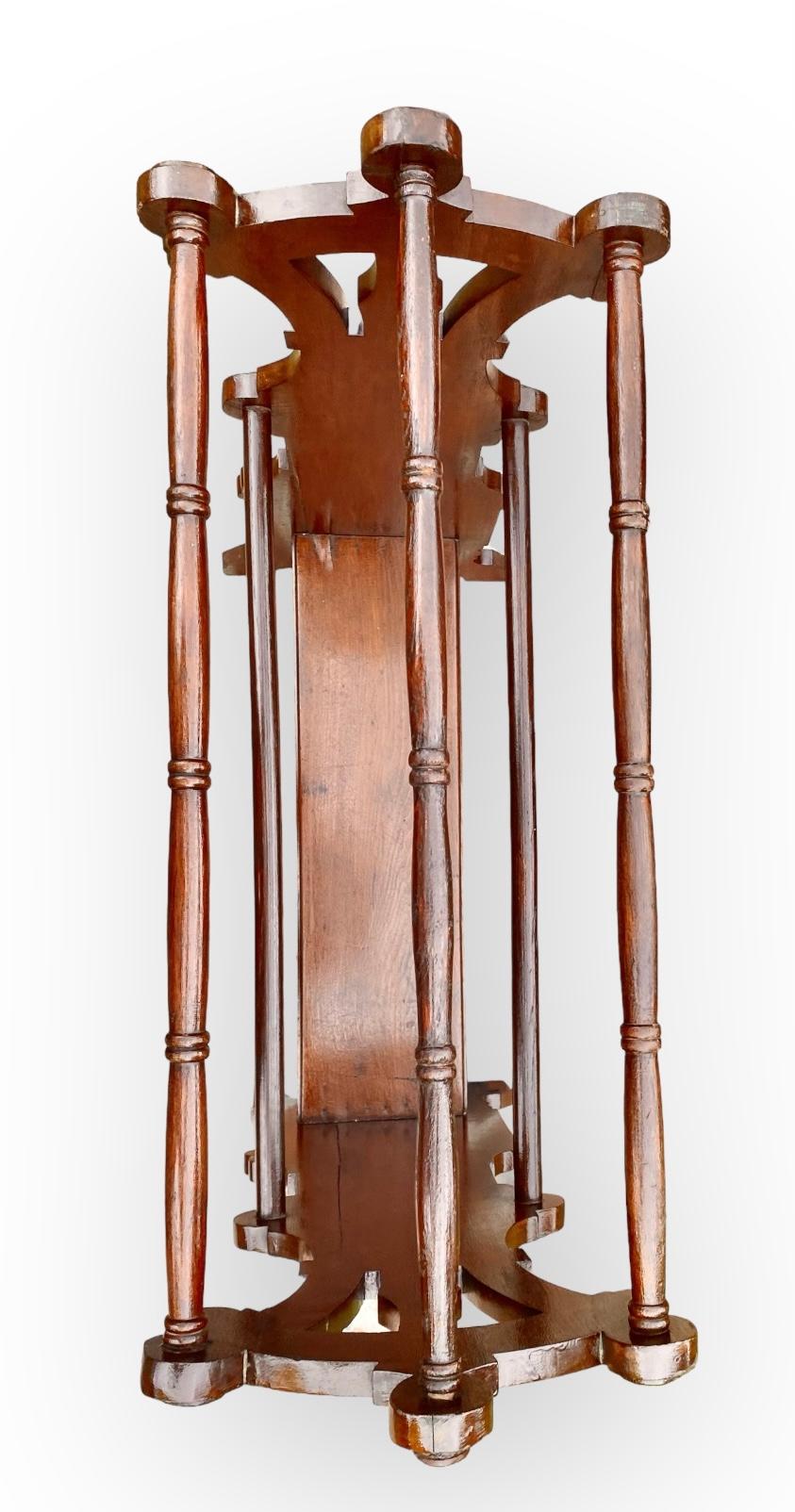 A period Eastlake Victorian quilt rack that is all original and has been cleaned and polished. Made of walnut with walnut burl panels, the finish is beautifully preserved.  This stand is still very sturdy and useful; It has three rods for hanging
