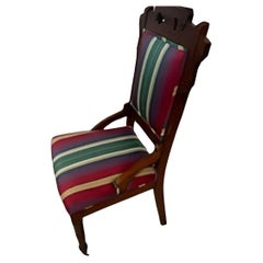 Vintage Eastlake chair with casters on front legs