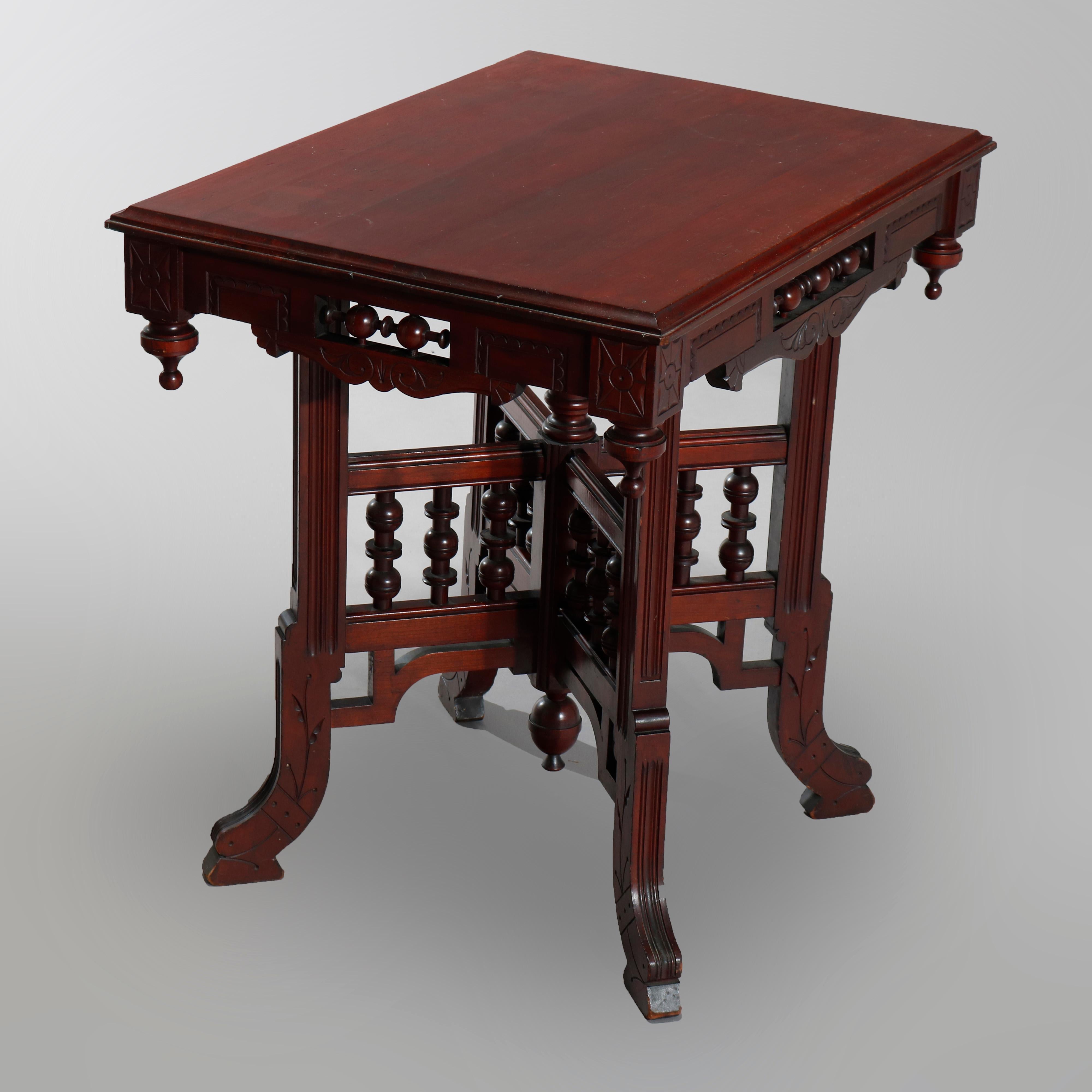 Carved Antique Eastlake Cherry Stick and Ball Parlor Lamp Table, circa 1890